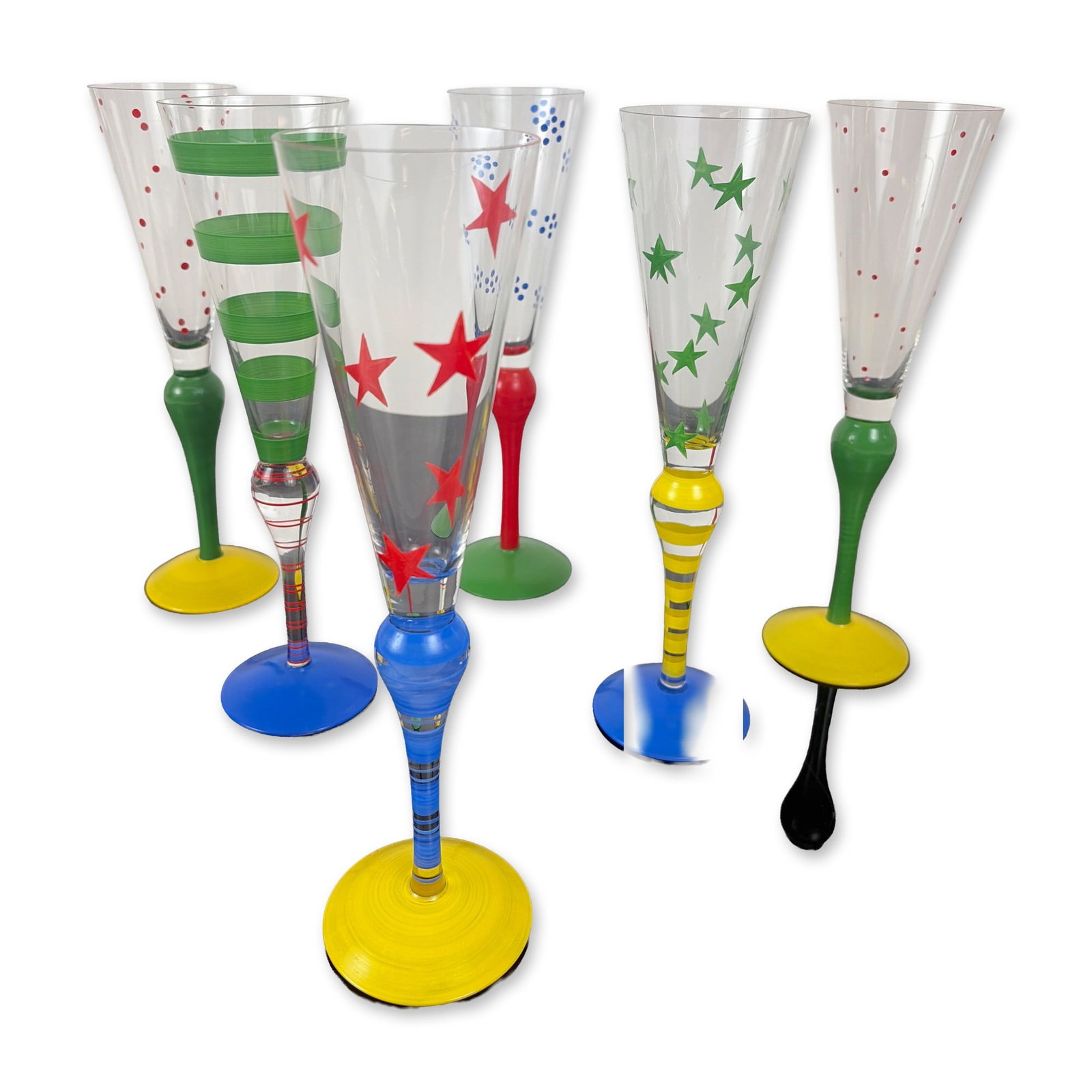 Set of Six Orrefors Clown Champagne Flutes: A set of hand-blown and hand-painted art glass champagne flutes from the Clown series, designed by Anne Nilsson for Orrefors, Sweden, circa 1990s. The set features various post-modern designs with bri