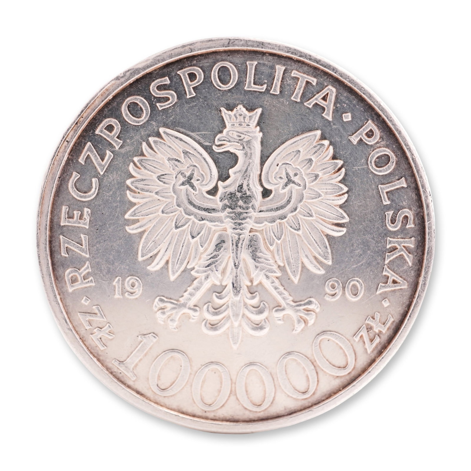 1990 U.S. Liberty Mint Silver Polish Commemorative Issue 100,000 Zlotys, Solidarity 1980-1990: Part of the Polish Road to Freedom series, this silver issue features the crowned Polish eagle above the denomination on the obverse. The reverse depicts the Solidarity Monument with the historic skyl