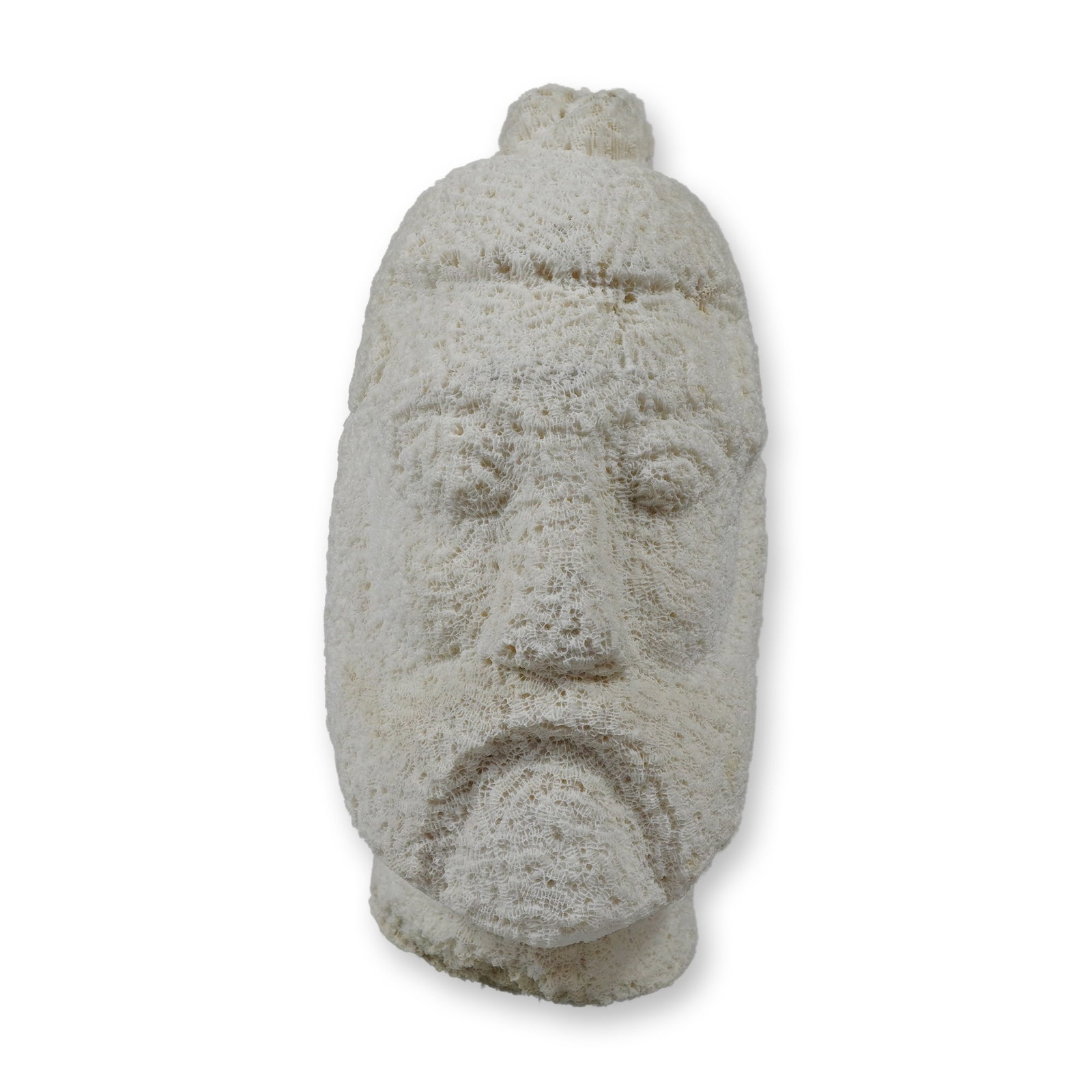 Carved White Coral Figural Head: This folk art sculpture depicts the head of an Asian warrior or deity, carved from a single piece of natural white stony coral. The figure is characterized by a stern facial expression with a