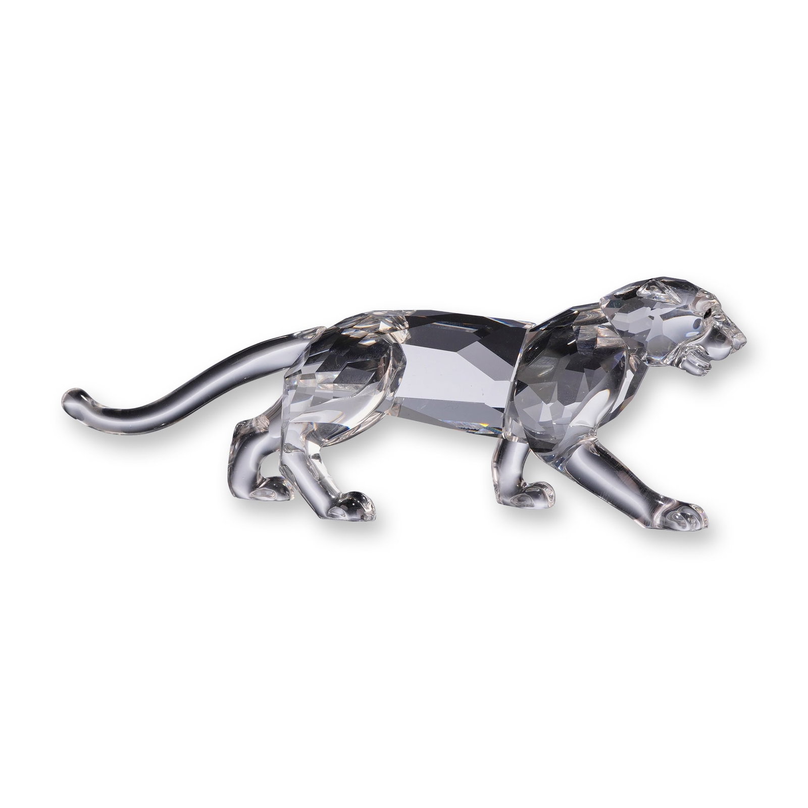Signed Swarovski Silver Crystal Signed Leopard Figurine: Swarovski Silver Crystal Leopard figurine from the African Wildlife collection, designed by Michael J. Stamey. Crafted in faceted clear lead crystal with green crystal eyes, the figurine depicts a leo