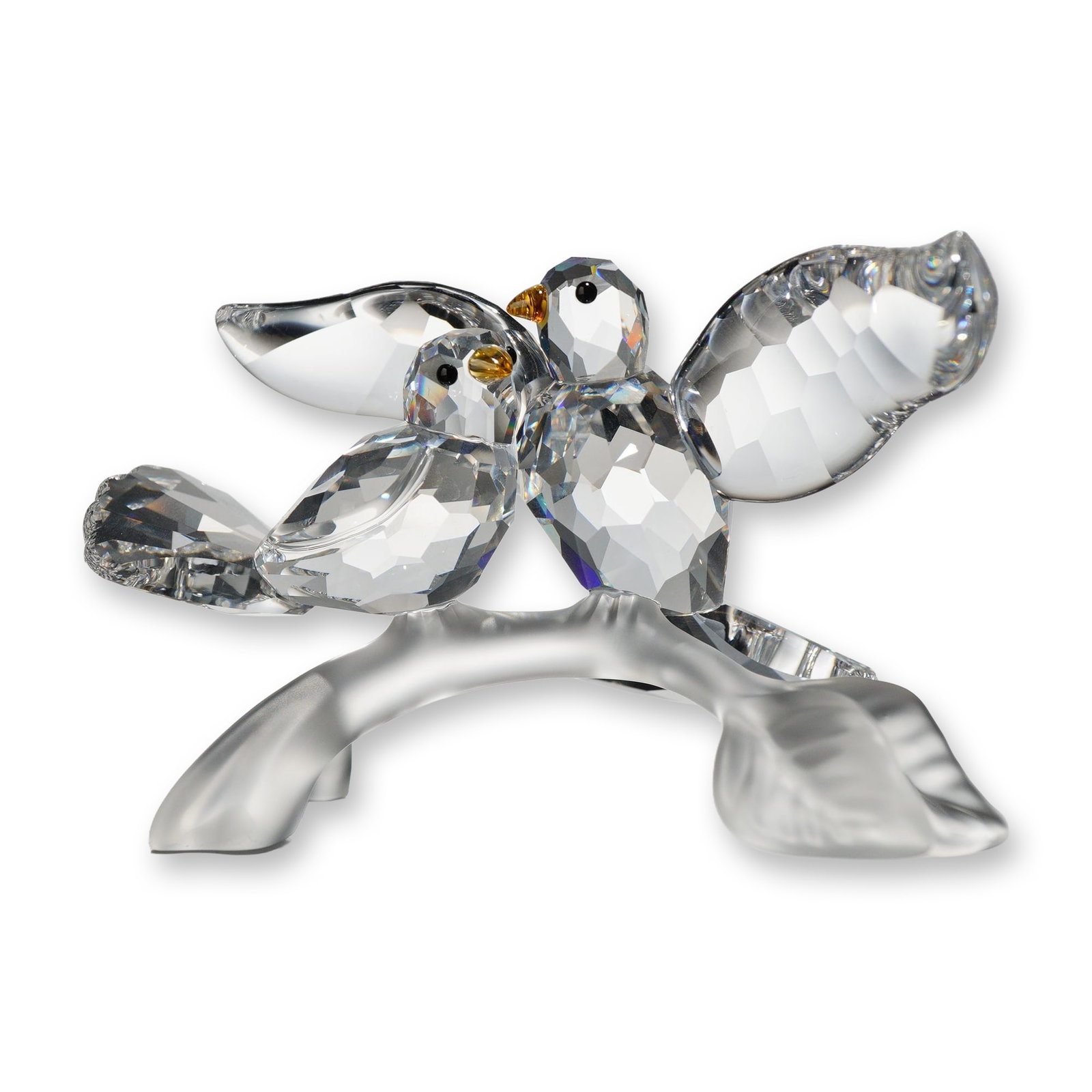 Swarovski Crystal Turtle Doves Figurine: Swarovski crystal figurine, model number 657378, titled Turtle Doves from the Feathered Beauties collection. The piece features two birds perched on a branch, one with wings outspread and the other ne