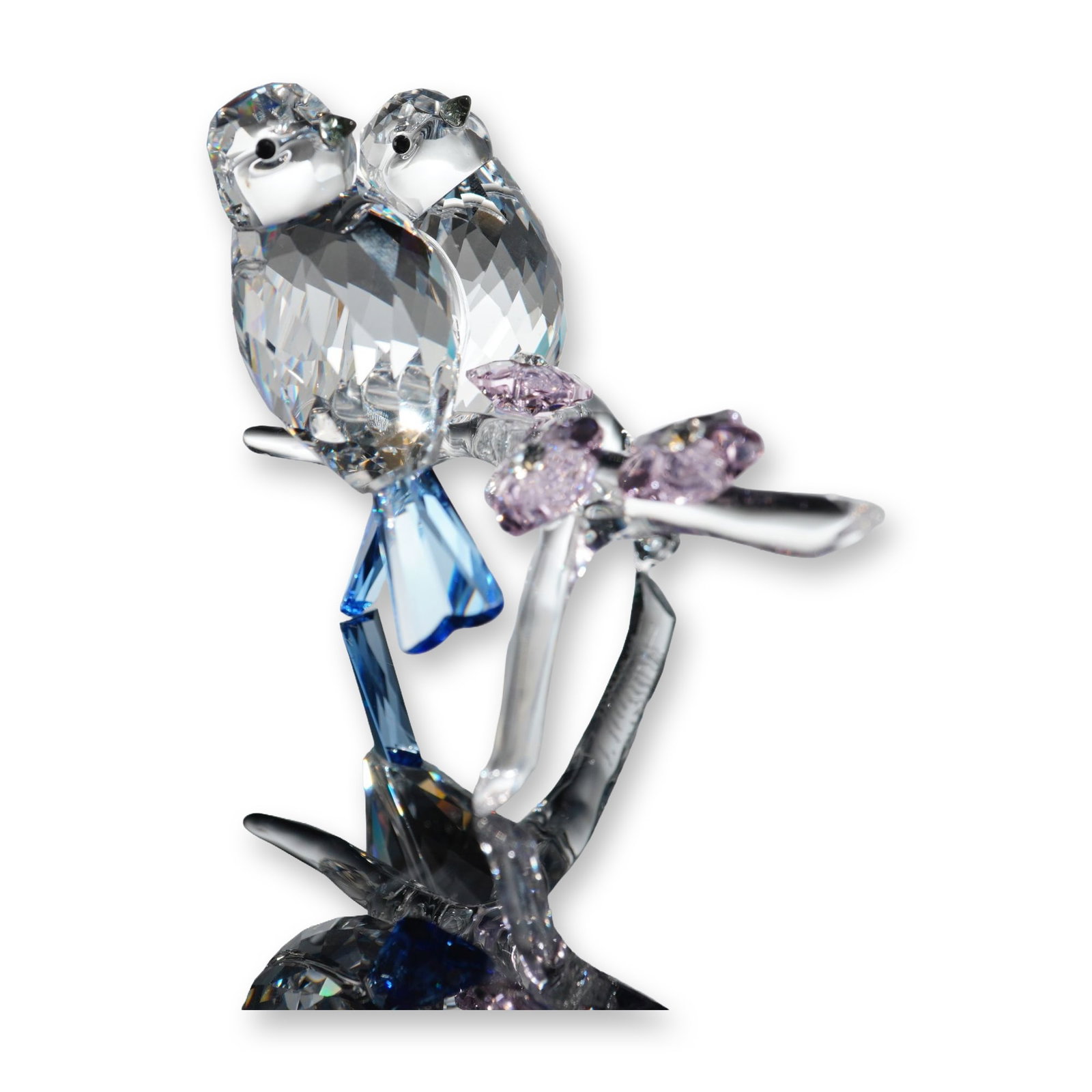 Swarovski Crystal Figurine, Blue Tits/Chickadees: Figurine in faceted lead crystal titled Blue Tits (Chickadees) featuring two birds perched on a flowering branch. Designed by Anton Hirzinger, the piece is crafted with clear faceted crystal bodies, b
