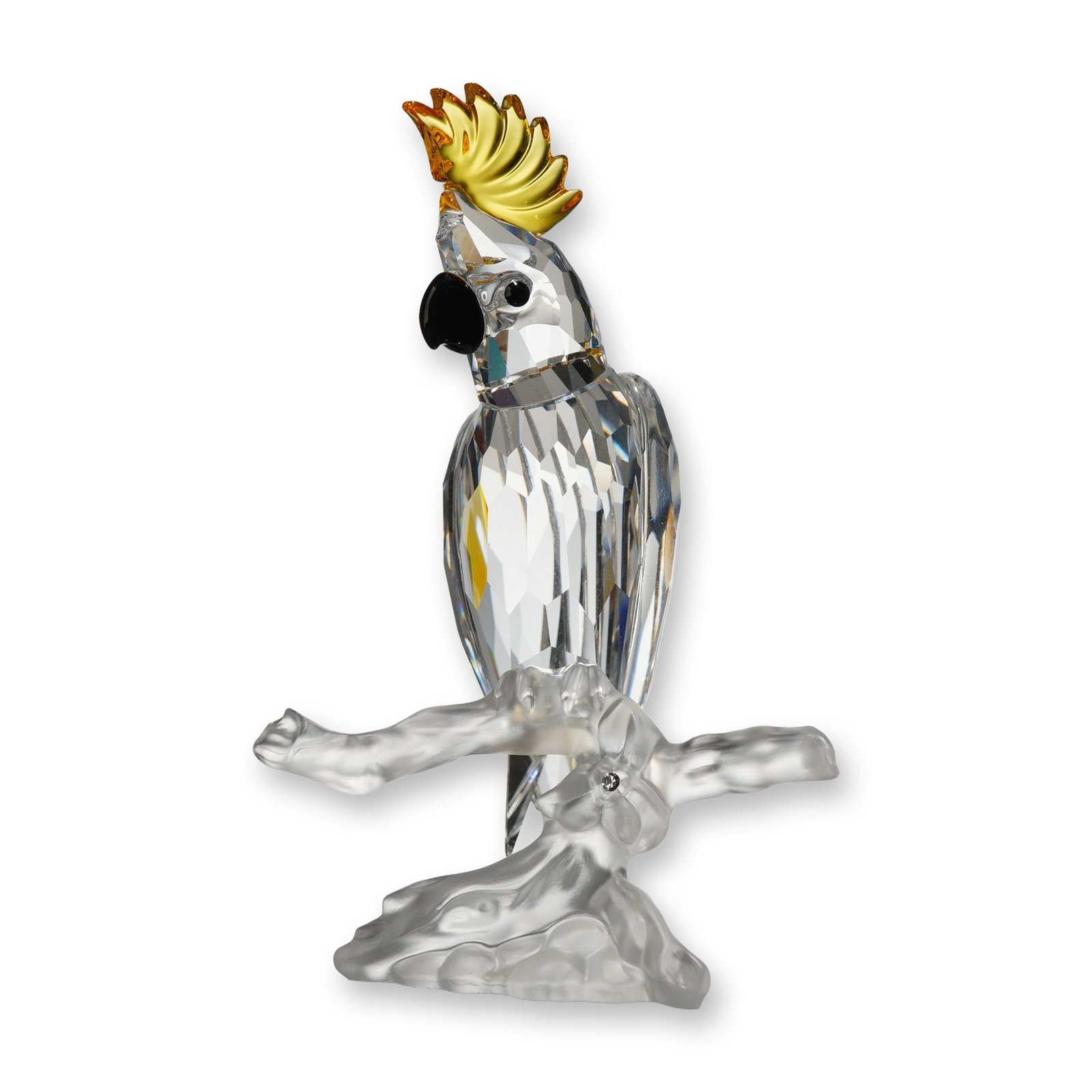 Swarovski Silver Crystal Cockatoo Figurine: Swarovski Silver Crystal collection cockatoo figurine, model number 261635. The faceted clear lead crystal bird features an amber faceted crest and black crystal accents for the eyes and beak. The fig