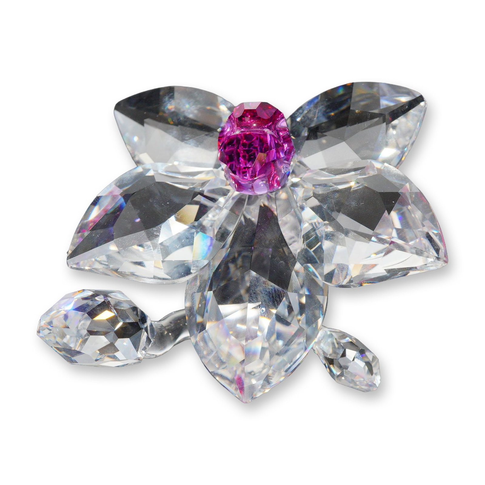 Swarovski Crystal Orchid Blossom Figurine: Swarovski. Orchid Blossom figurine in faceted lead crystal, model number 864464. The piece features a central pink faceted crystal center surrounded by six clear faceted crystal petals, set on a clear