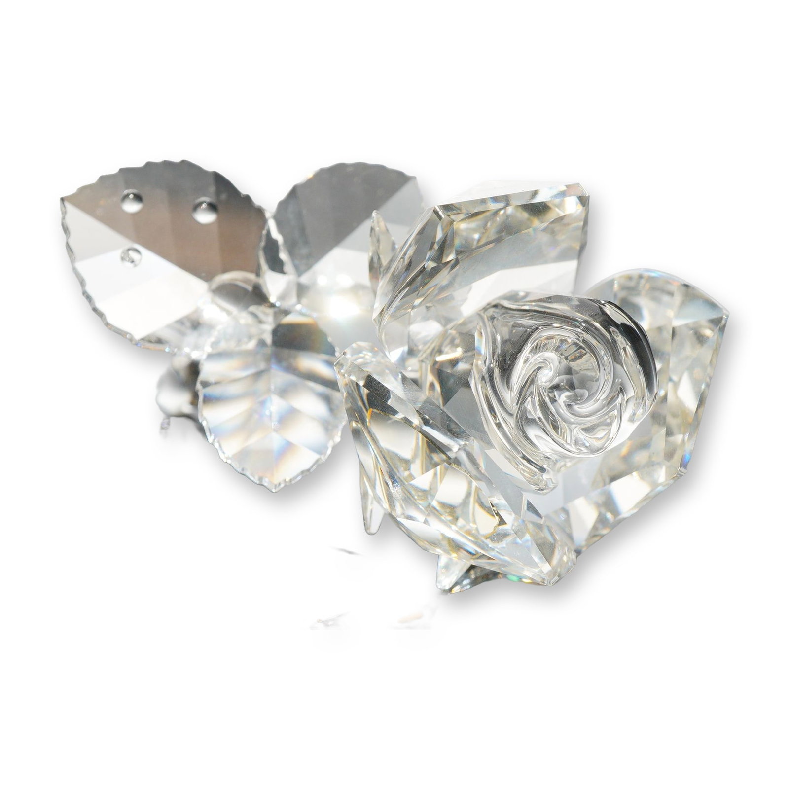 Swarovski Silver Crystal Rose Figurine: Swarovski Silver Crystal rose figurine in multi-faceted clear lead crystal. The rose blossom features faceted outer petals and a molded swirl center, set on a smooth, curved stem branching to two face
