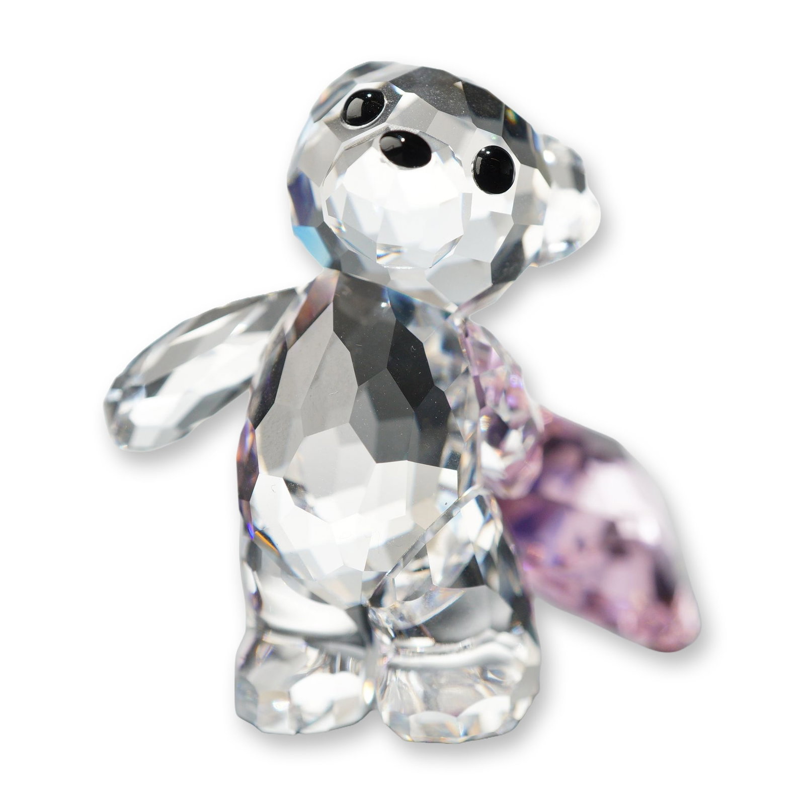 Swarovski Crystal Kris Bear With You Figurine: Swarovski. Kris Bear collection figurine titled With You, crafted in faceted lead crystal. The figure features a clear faceted crystal bear holding a large faceted pink crystal heart. Detailed with je