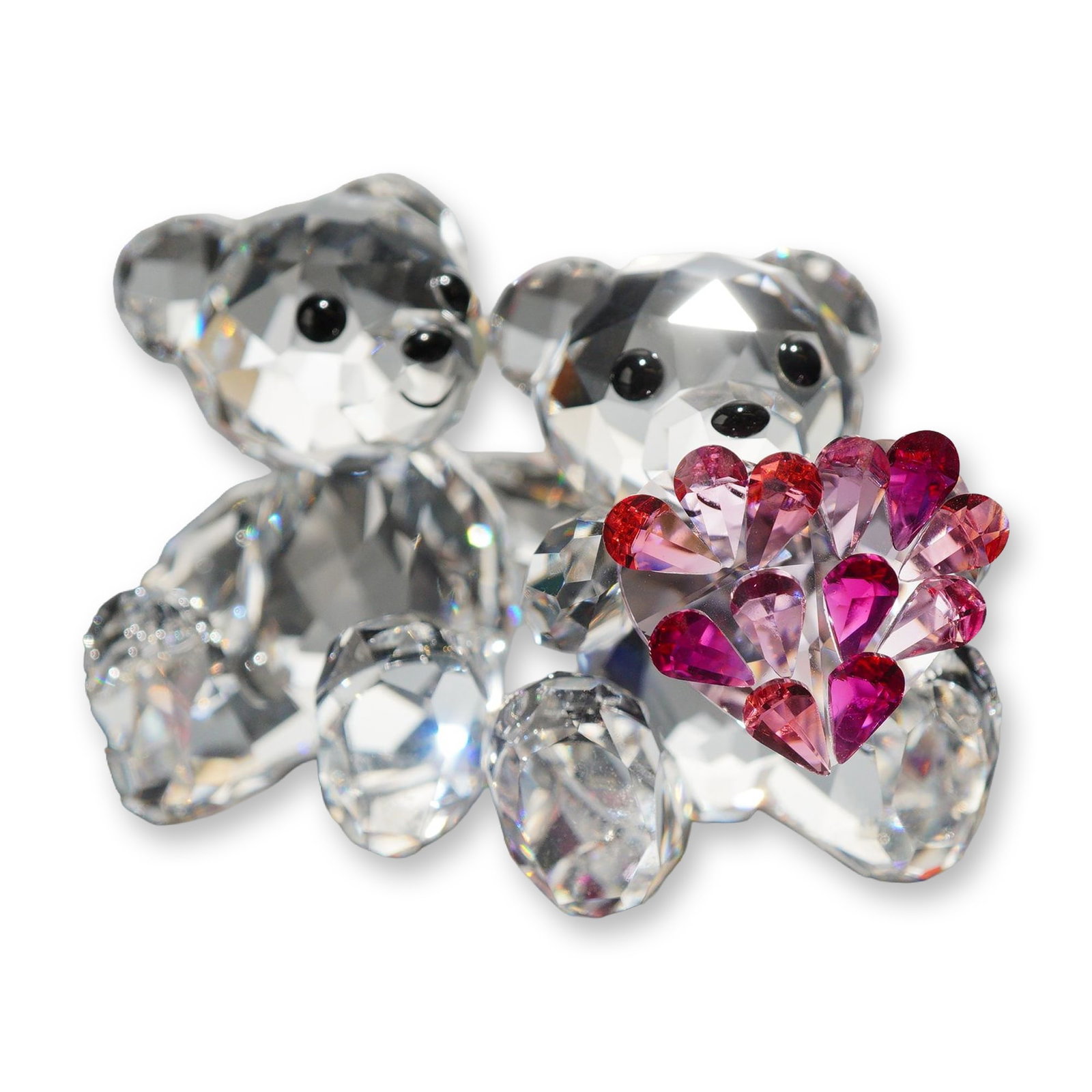 Swarovski Crystal Kris Bear in Love Figurine: Swarovski crystal figurine, Kris Bear in Love, featuring two faceted clear crystal bears seated side-by-side. The bear on the right holds a heart motif composed of multiple heart-shaped crystals in sh