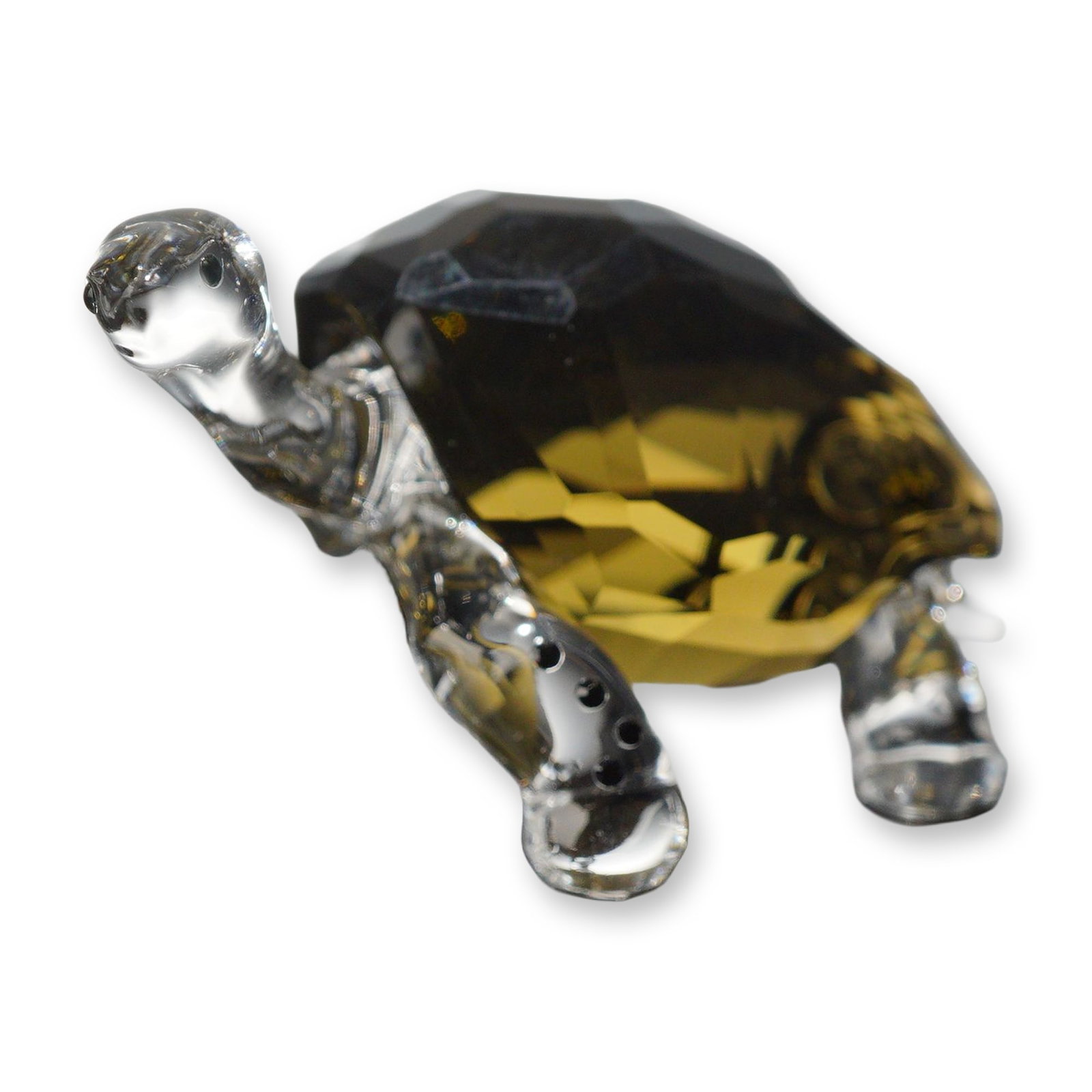 Swarovski Crystal Galapagos Tortoise Figurine: Swarovski crystal Galapagos Tortoise figurine, model number 995036, designed as a 2010 SCS event exclusive. The figurine features a faceted amber-colored crystal shell contrasted by a clear molded cry