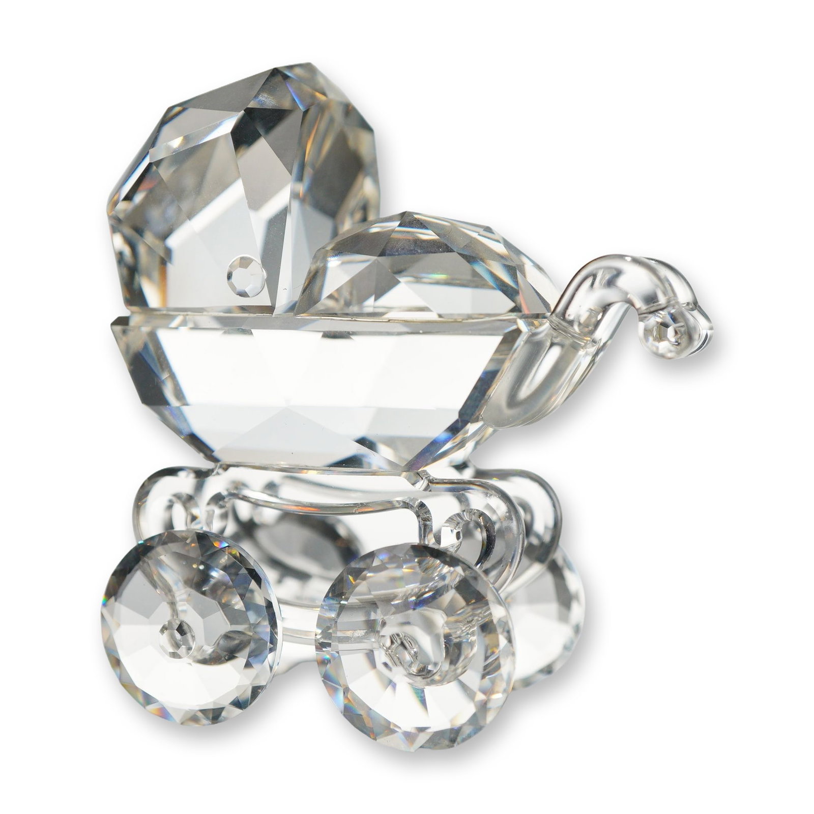 Swarovski Silver Crystal Baby Carriage Figurine: Swarovski Silver Crystal baby carriage figurine crafted in faceted clear lead crystal. The design features a faceted body, hood, and wheels, with smooth curved crystal elements forming the handle and 
