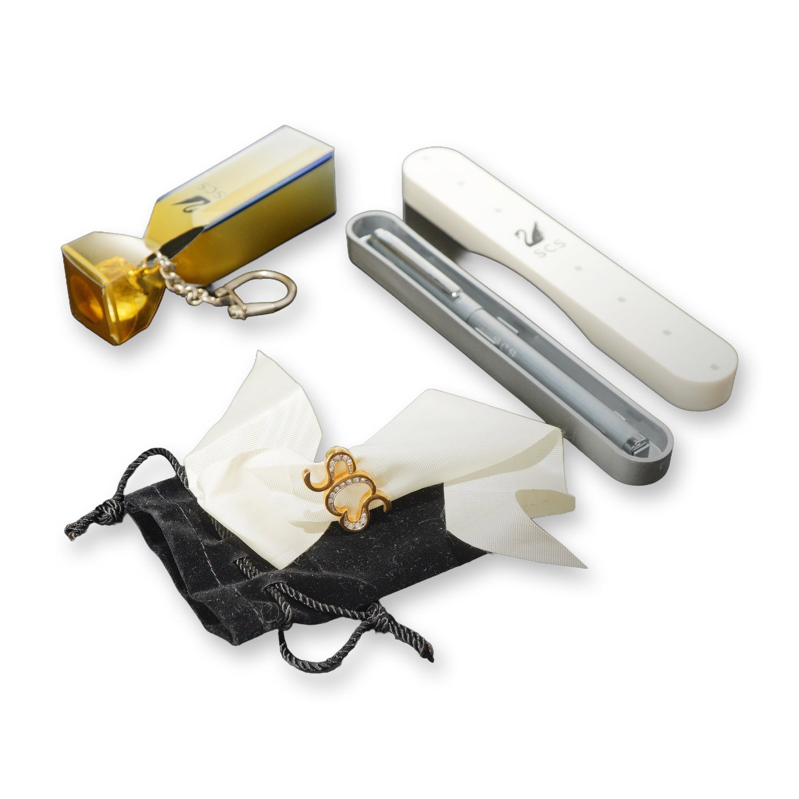 3pc Swarovski SCS Gift Set: Swarovski Crystal Society (SCS) membership gift collection. Three-piece set comprising a ballpoint pen, a keychain, and a brooch. The ballpoint pen is constructed with a brushed silver-tone metal barr