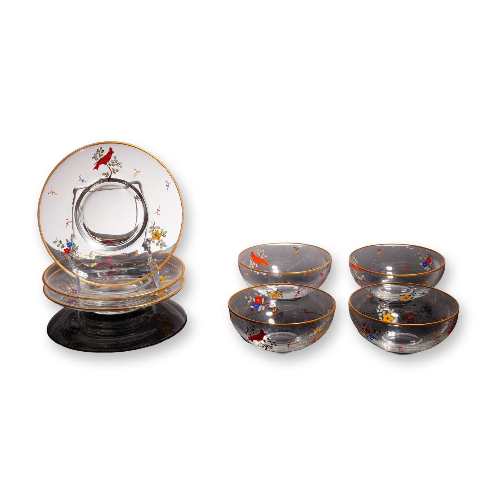 7pc Hand-Painted Glass Cardinal Tableware Set: Consisting of three plates with central wells and four small bowls. Each clear glass piece features a gilded gold rim and is decorated with hand-painted enamel designs of red cardinals perched on bran