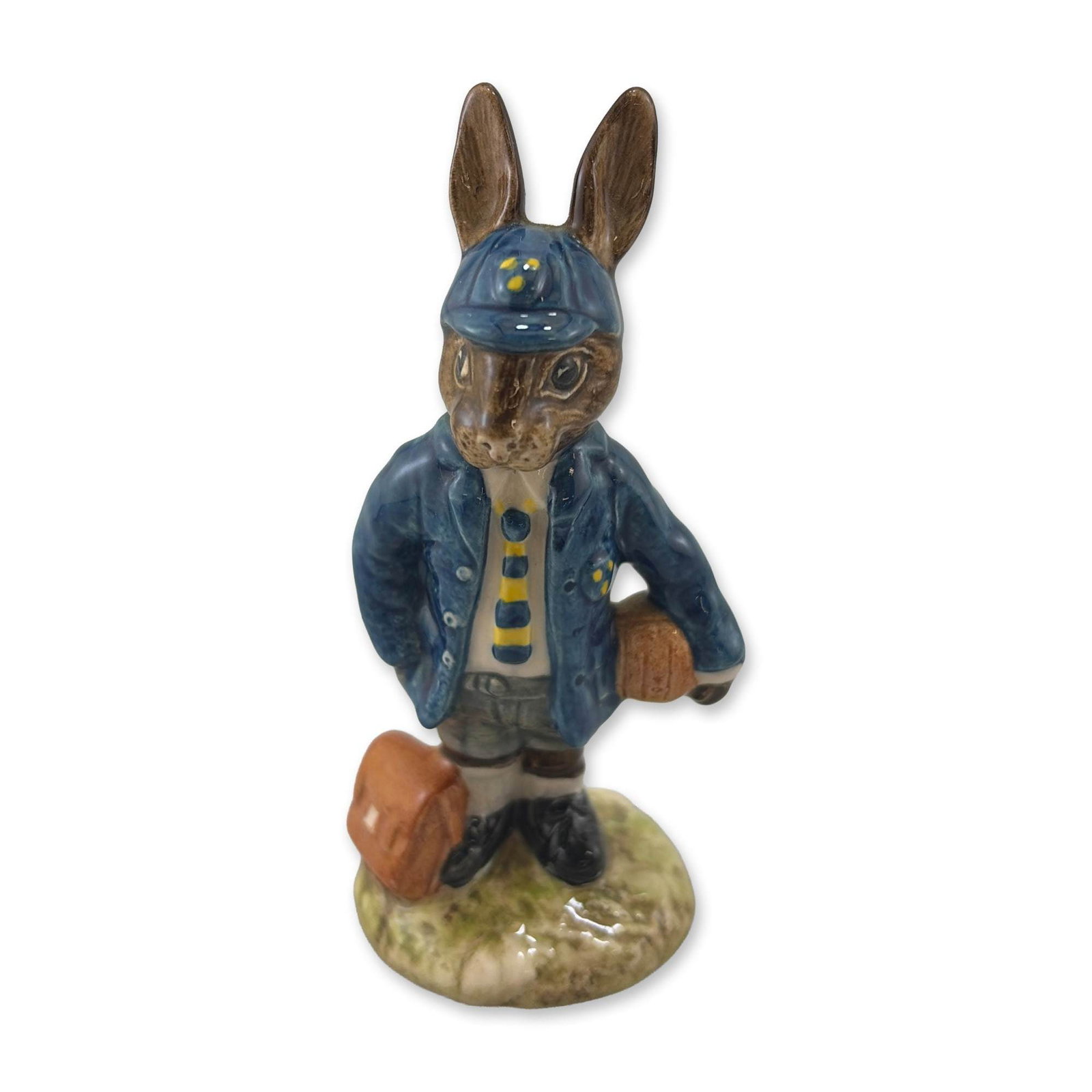 Royal Doulton Schoolboy Bunnykins DB66 Figurine: Royal Doulton. Schoolboy Bunnykins figurine in glazed porcelain, model DB 66, featuring an anthropomorphic rabbit in a British school uniform with a blue blazer, striped tie, and matching cap. The fig