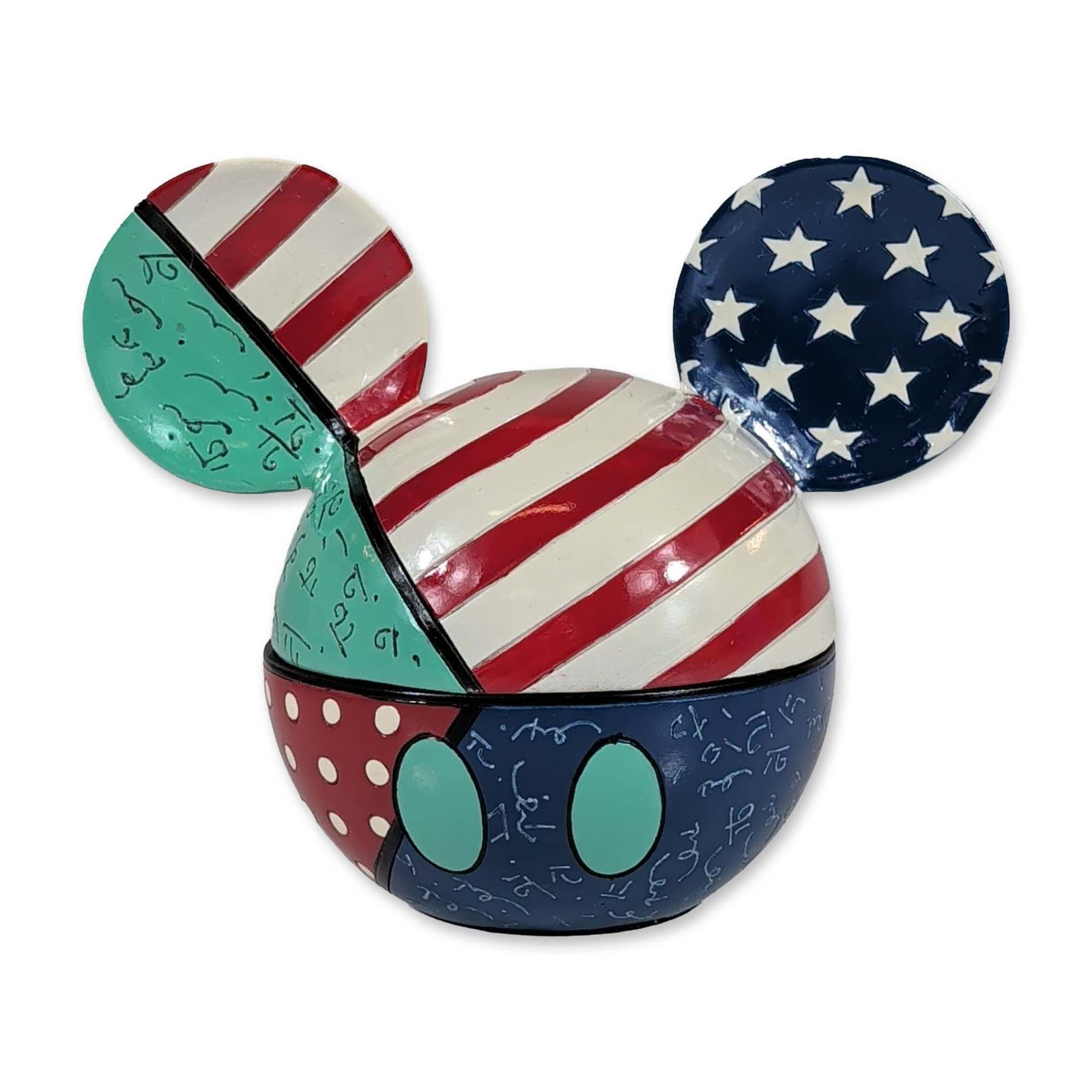 Disney by Britto Mickey Mouse Stars and Stripes Covered Box: Disney by Romero Britto. Hinged trinket box in the form of a Mickey Mouse head, featuring a polychrome pop-art patchwork design. The decoration includes American flag-inspired stars and stripes, teal 