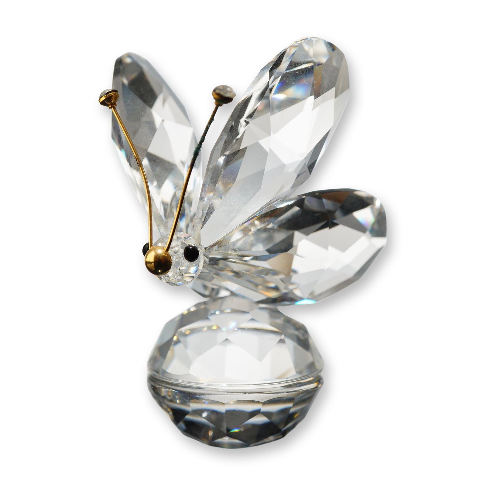 Swarovski Silver Crystal Large Butterfly Figurine: Swarovski. Large butterfly figurine from the Silver Crystal collection in faceted clear lead crystal, featuring four faceted wings and a circular faceted base. The figure includes two gold-tone wire a