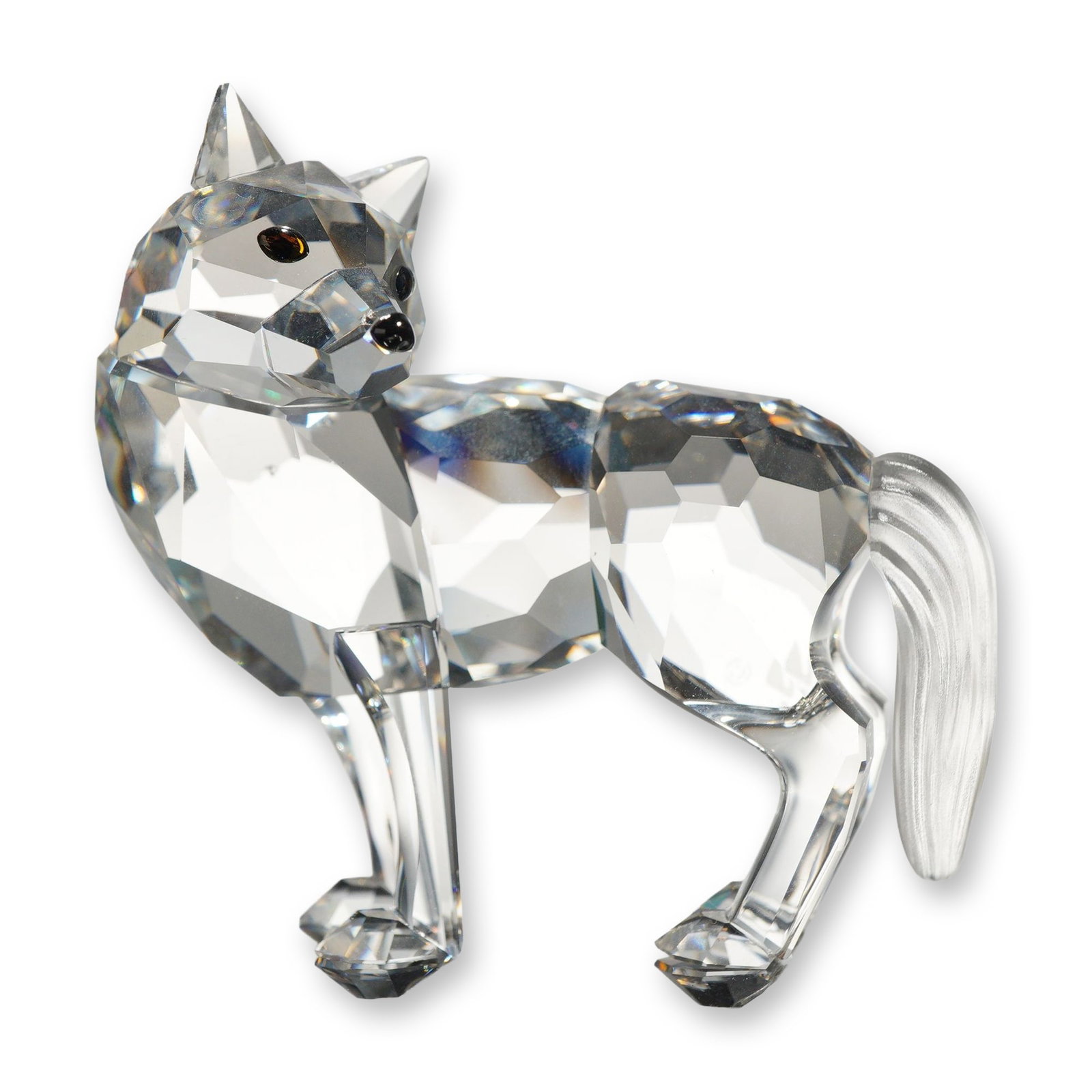 Swarovski Crystal Wolf Figurine: Swarovski Crystal wolf figurine, model number 207549, designed with a faceted clear lead crystal body, head, and legs. Features applied dark brown crystal eyes, a black crystal nose, and a frosted, te