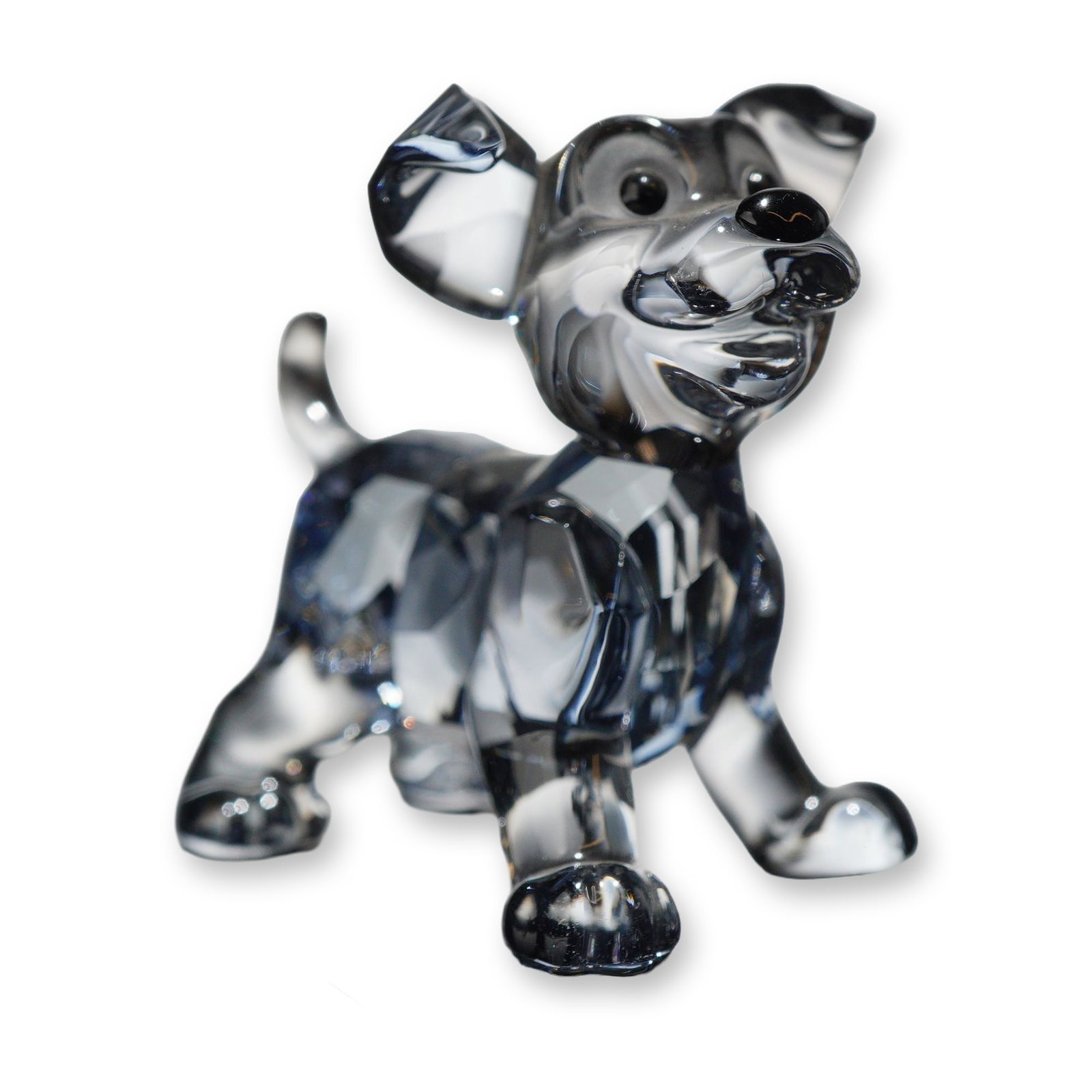 Swarovski Crystal Scamp Puppy Figurine: Swarovski crystal figurine titled Scamp, depicting a standing puppy in faceted clear crystal with applied black crystal eyes and nose. The figure features one folded ear and one upright ear with a sli