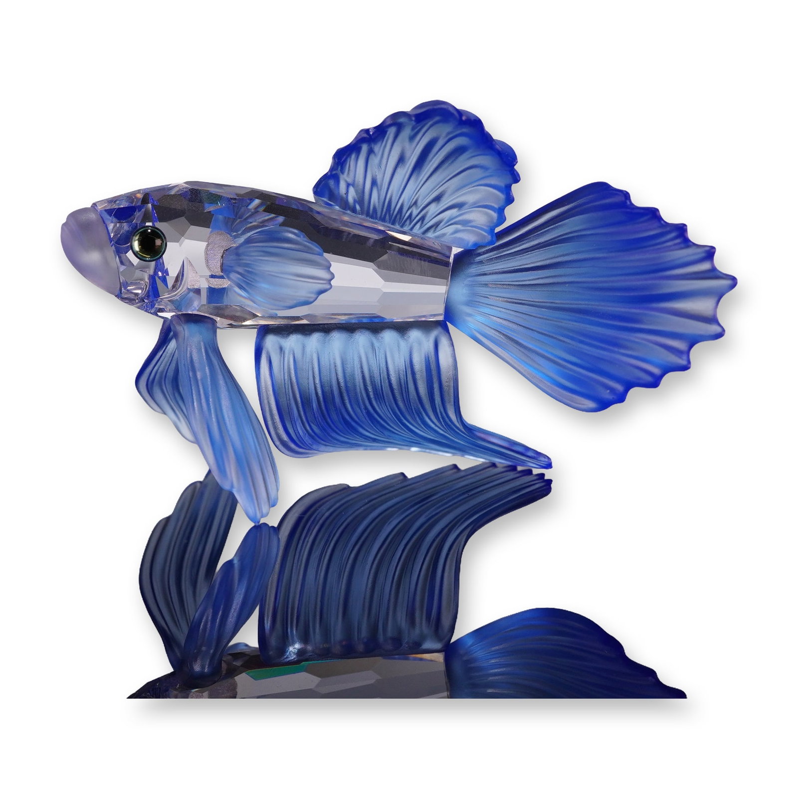 Swarovski Crystal Figurine, Blue Siamese Fighting Fish: The figure features a faceted clear crystal body accented with frosted, ribbed blue crystal fins and a frosted pale lavender mouth. The eyes are set with dark cabochon crystal elements. Features an ac