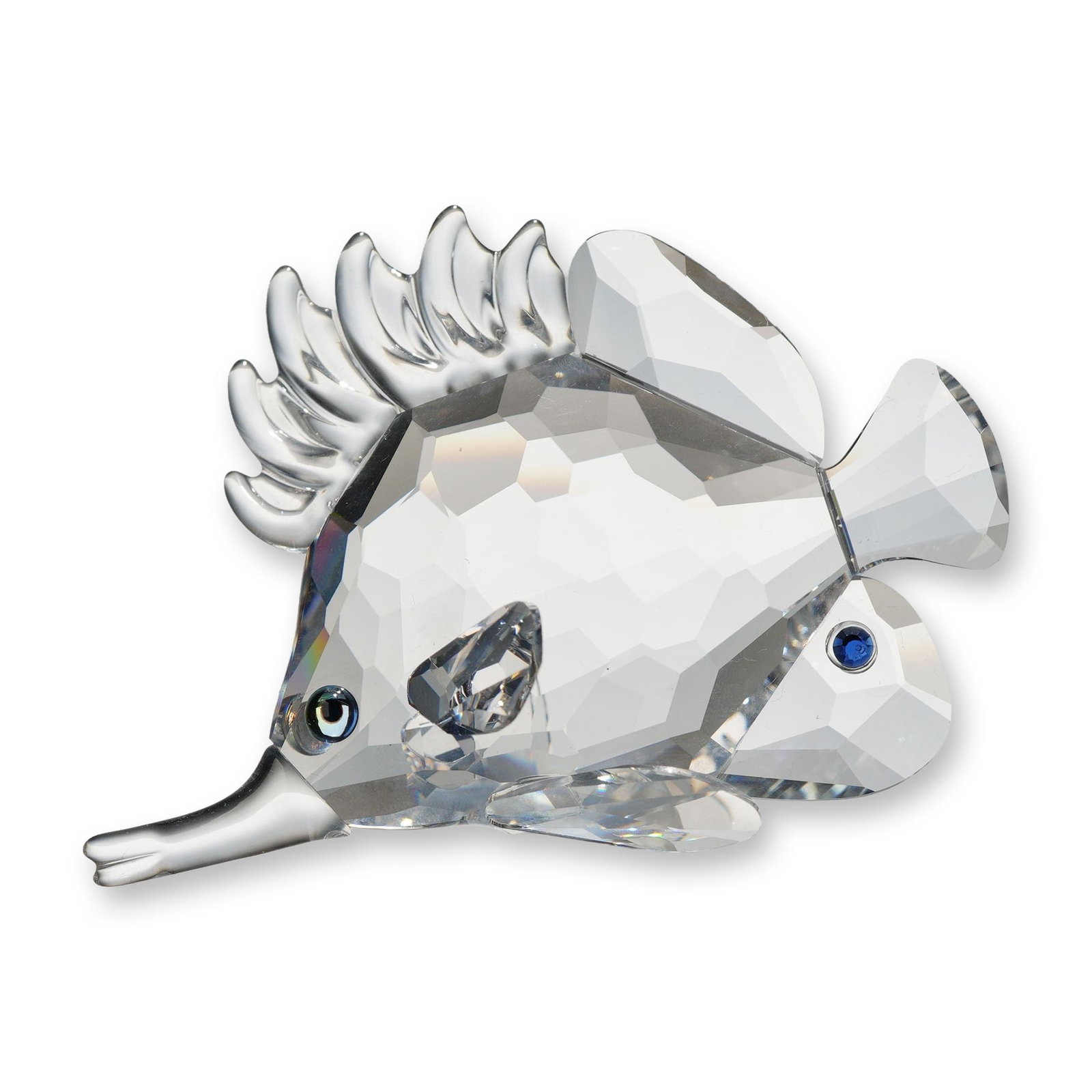Swarovski Crystal Longnose Butterflyfish Figurine: Swarovski. Figurine in clear faceted and frosted lead crystal, featuring a longnose butterflyfish with inset blue crystal eyes and dorsal markings. The figure is mounted on a textured frosted crystal 