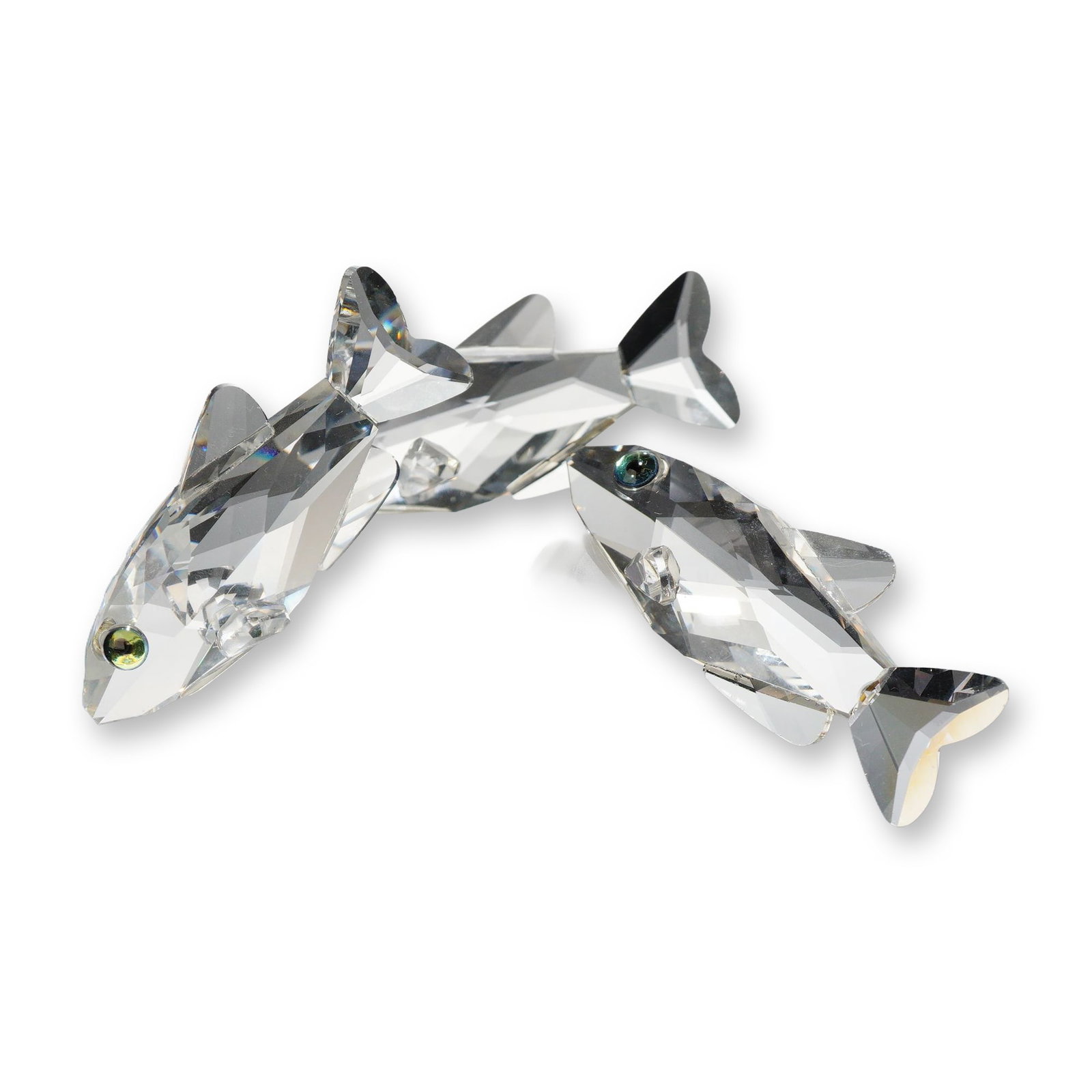 Swarovski Silver Crystal South Sea Fish Figurine: Swarovski Silver Crystal figurine, South Sea Fish. Composed of lead crystal with a faceted finish, the piece features a trio of fish swimming over a frosted crystal base modeled as a coral reef. Each 