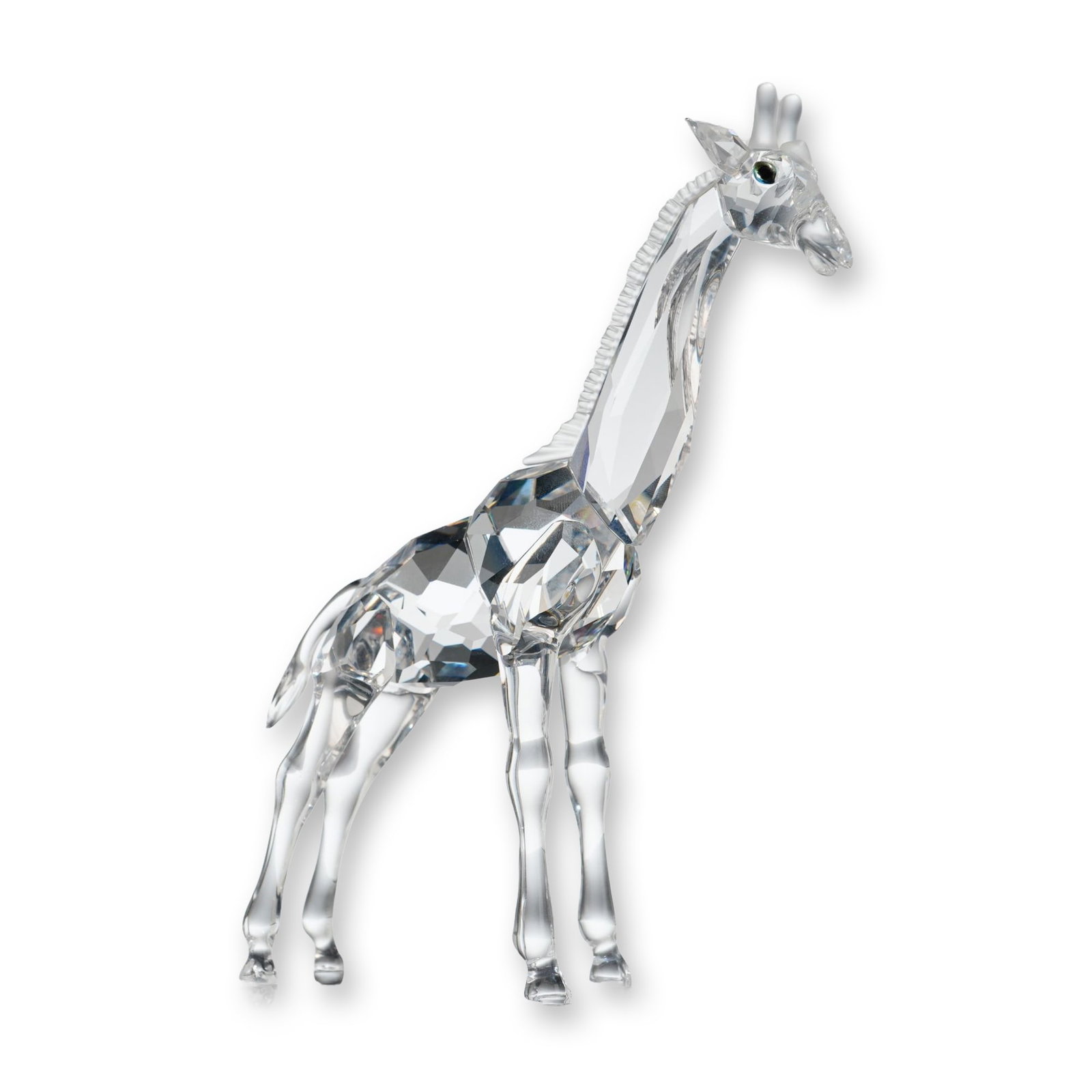 Swarovski Crystal Figurine Baby Giraffe: Swarovski Silver Crystal figurine of a baby giraffe from the African Wildlife collection. The piece is constructed from clear faceted and molded lead crystal, featuring a faceted torso and neck with s