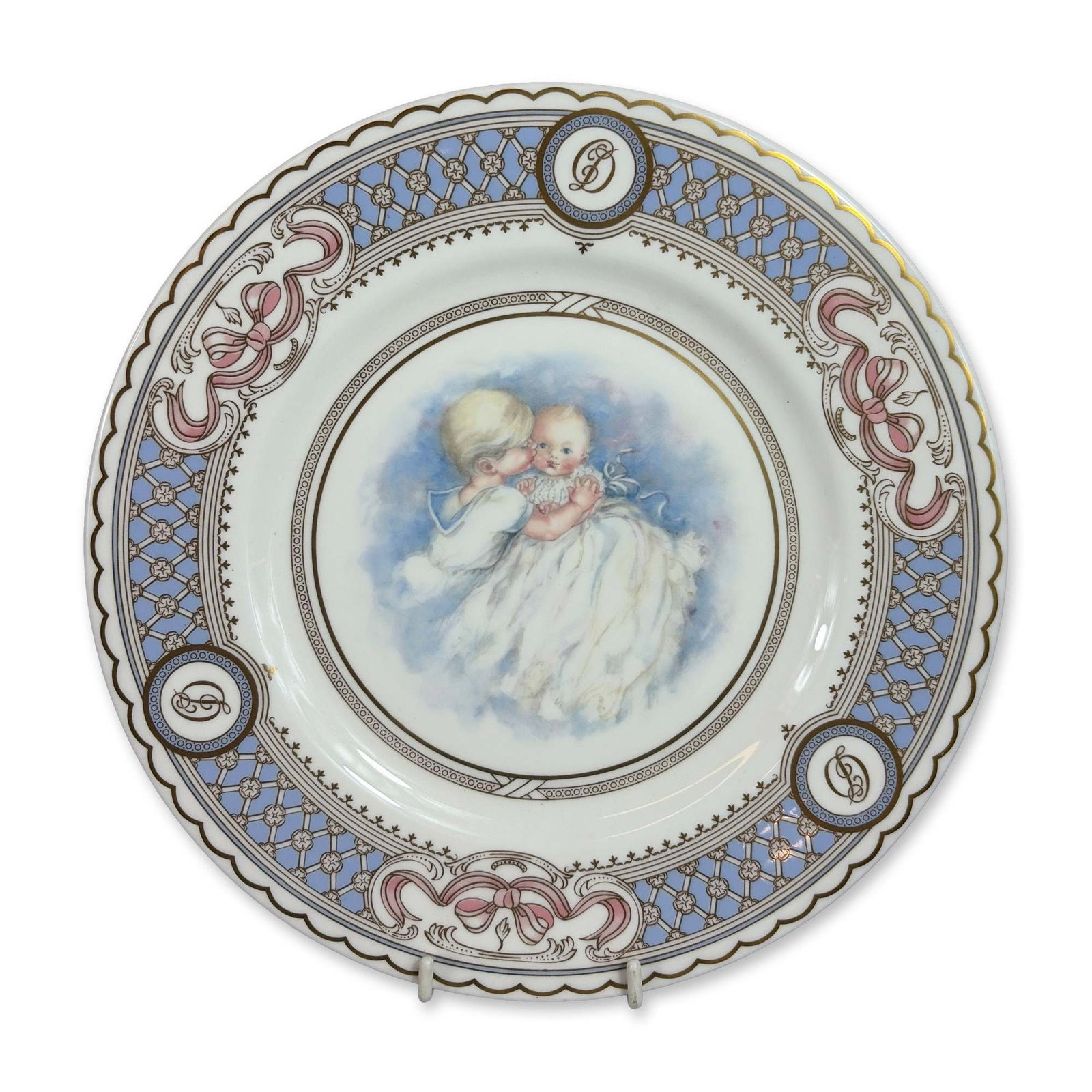 Royal Doulton Prince Henry Birth Celebration Plate: Royal Doulton. Commemorative celebration plate in fine bone china, issued to mark the birth of Prince Henry of Wales in 1984. The central well features a transfer-printed portrait of the infant prince