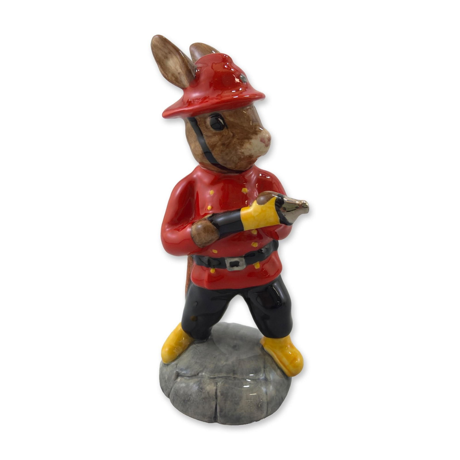 Royal Doulton Fireman Bunnykins Porcelain Figurine DB 183: Royal Doulton glazed porcelain figurine titled Fireman Burnykins, model DB 183. Part of the Bunnykins series, the figure depicts an anthropomorphic rabbit in a firefighter uniform featuring a red coat