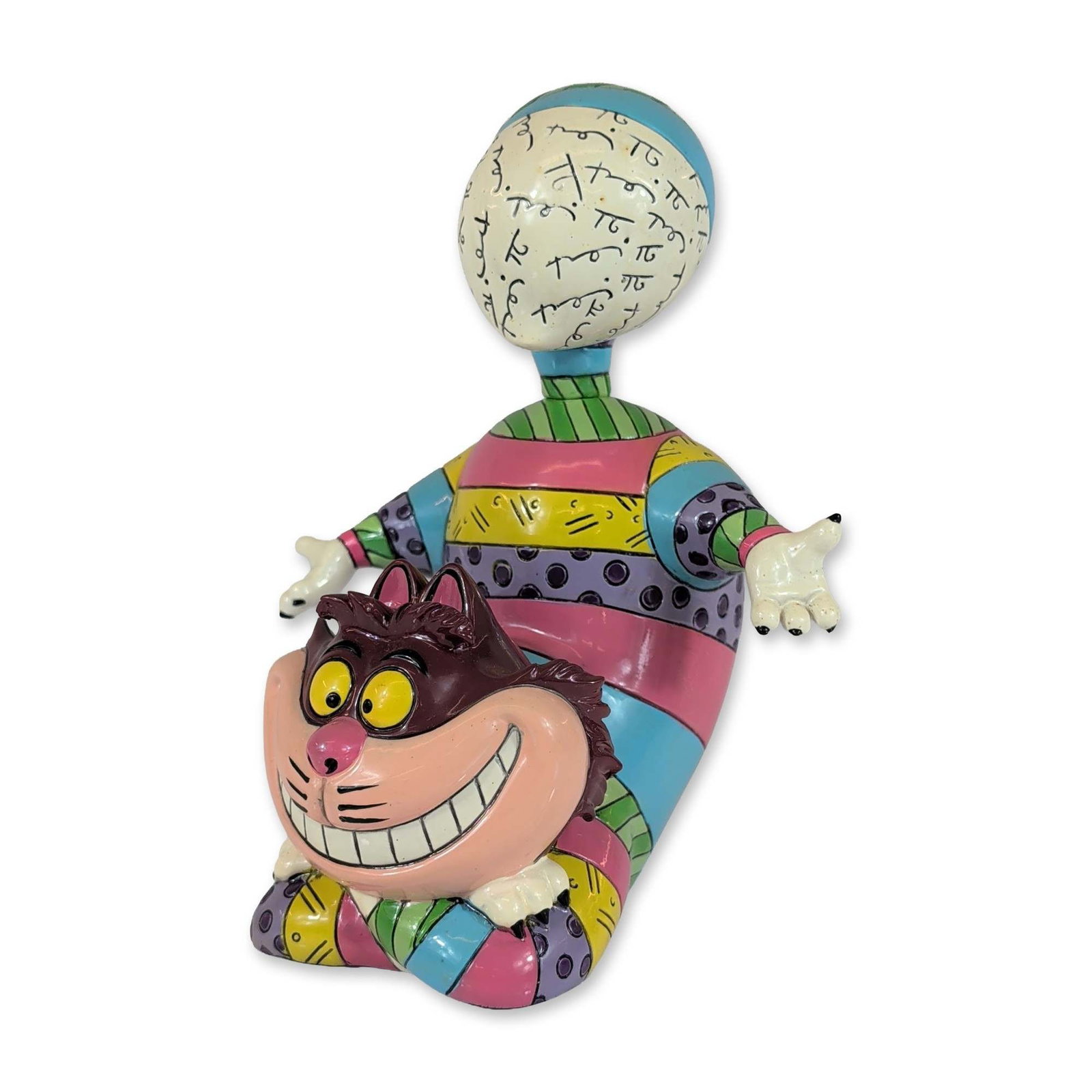 Disney by Britto Cheshire Cat Figurine: Disney Showcase Disney by Britto figurine of the Cheshire Cat from Alice in Wonderland. Hand-painted resin construction in a pop-art style designed by Romero Britto, featuring a multicolored