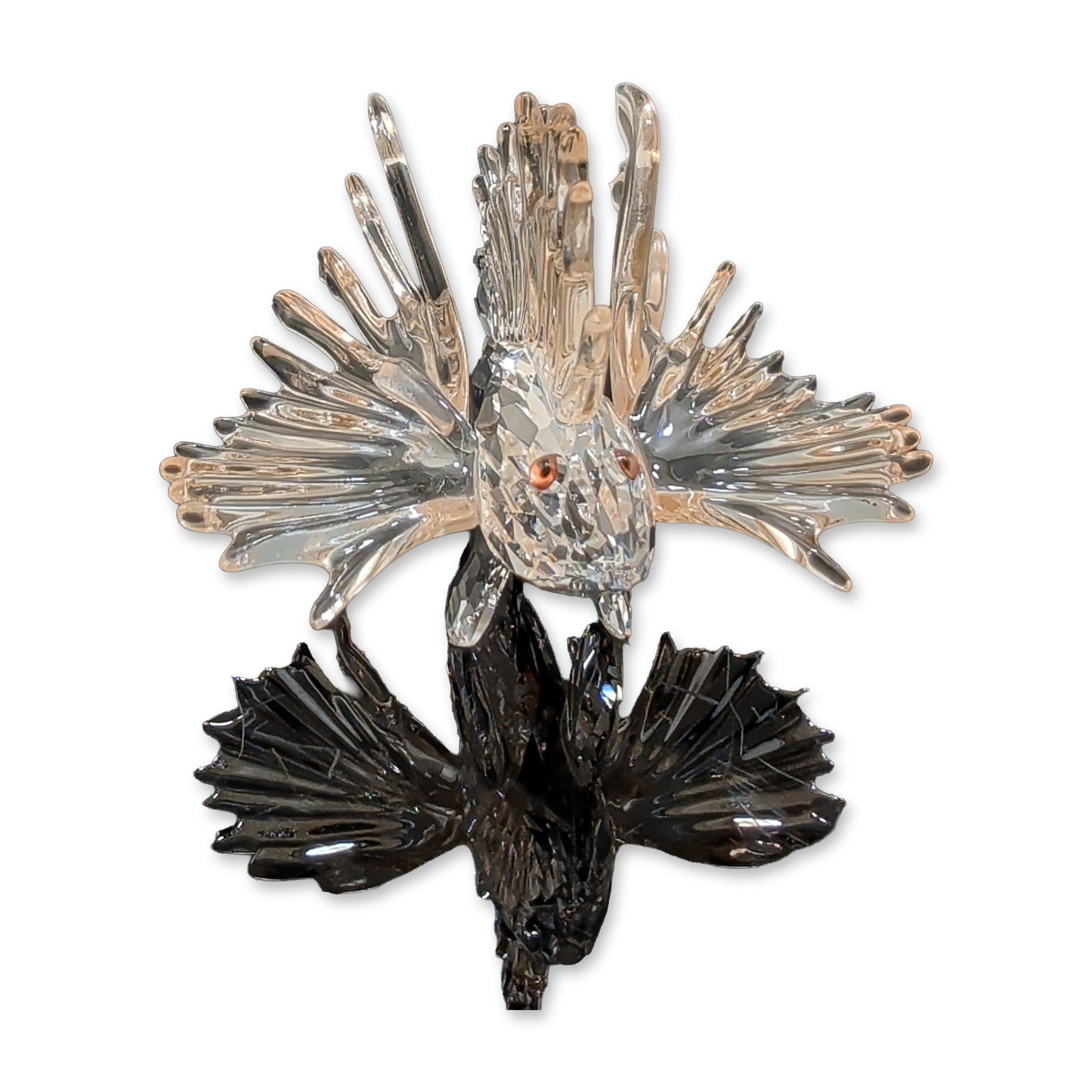 Swarovski Crystal South Sea Figurine, Lion Fish: Swarovski South Sea Lion Fish figurine in faceted lead crystal, featuring a textured body with extended spiny fins and circular reddish-orange crystal eyes. Marked with an etched swan logo on the base