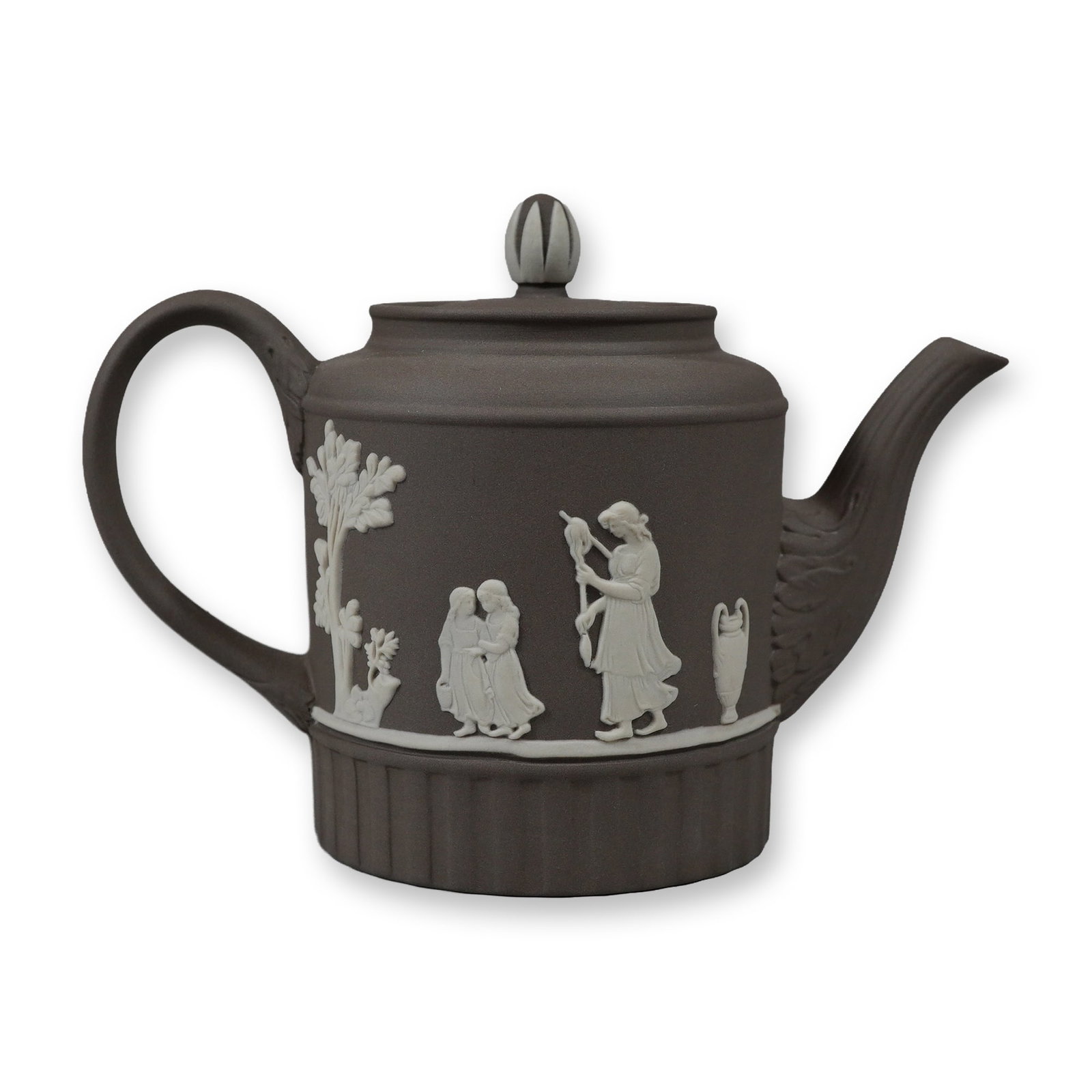 Wedgwood Domestic Employment Pattern Taupe Jasperware Teapot: A Wedgwood jasperware teapot featuring a taupe or dark charcoal-grey stoneware body. The piece is part of the Domestic Employment series and is designed with a cylindrical form and a fluted lower base