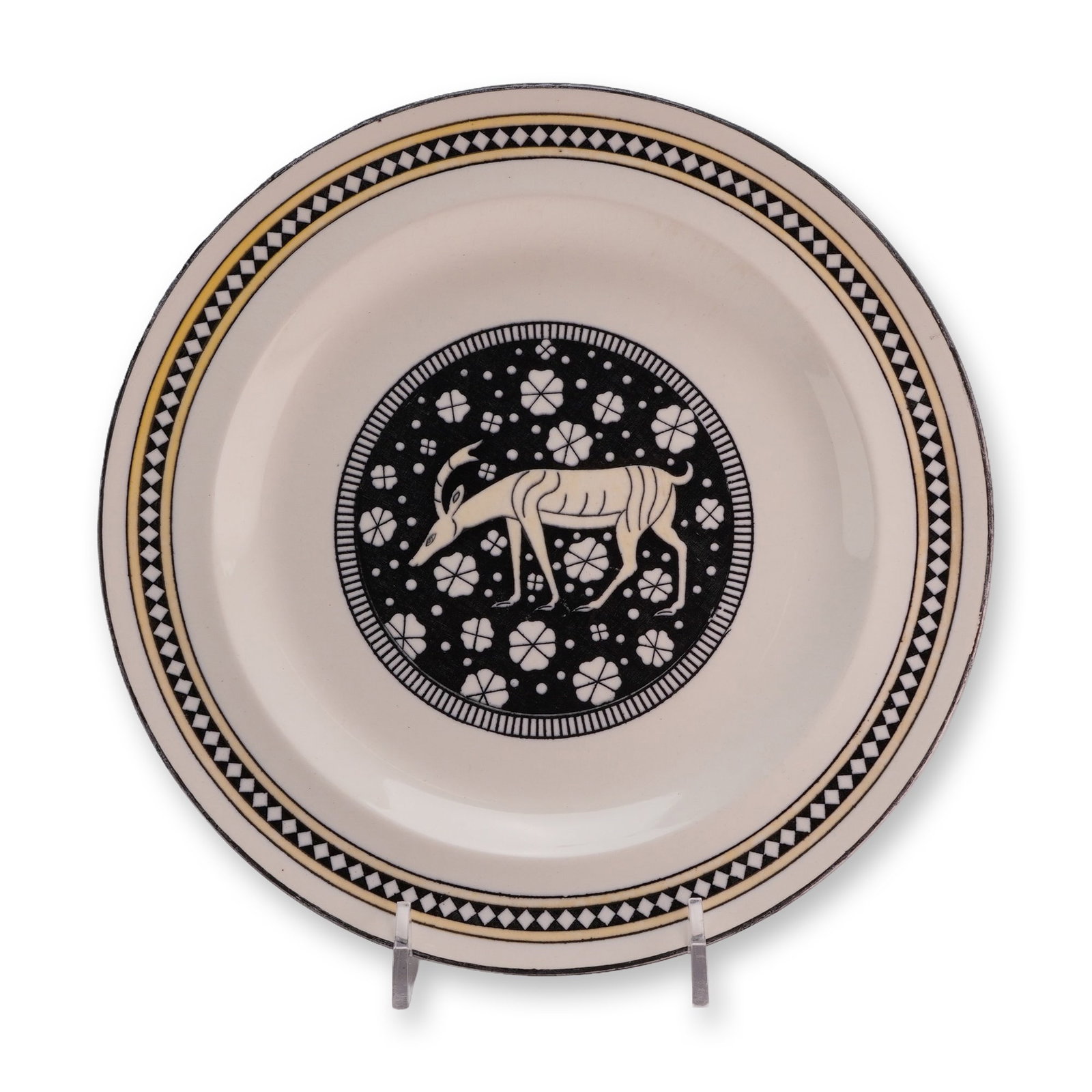 Wedgwood Etruria England Earthenware Plate Istria Pattern circa 1923: A Wedgwood cream-colored earthenware (Queen's Ware) plate featuring the Istria pattern, produced in Etruria, England. The Art Deco-influenced design features a central circular reserve with a black gr
