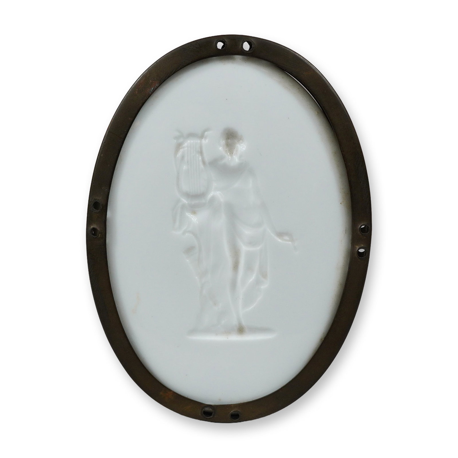 Wedgwood White Ceramic Oval Intaglio Plaque Depicting Apollo: This oval plaque is crafted from Wedgwood fine white earthenware. The face features an intaglio-carved classical figure of Apollo standing in profile while holding a lyre. The figure is draped in clas