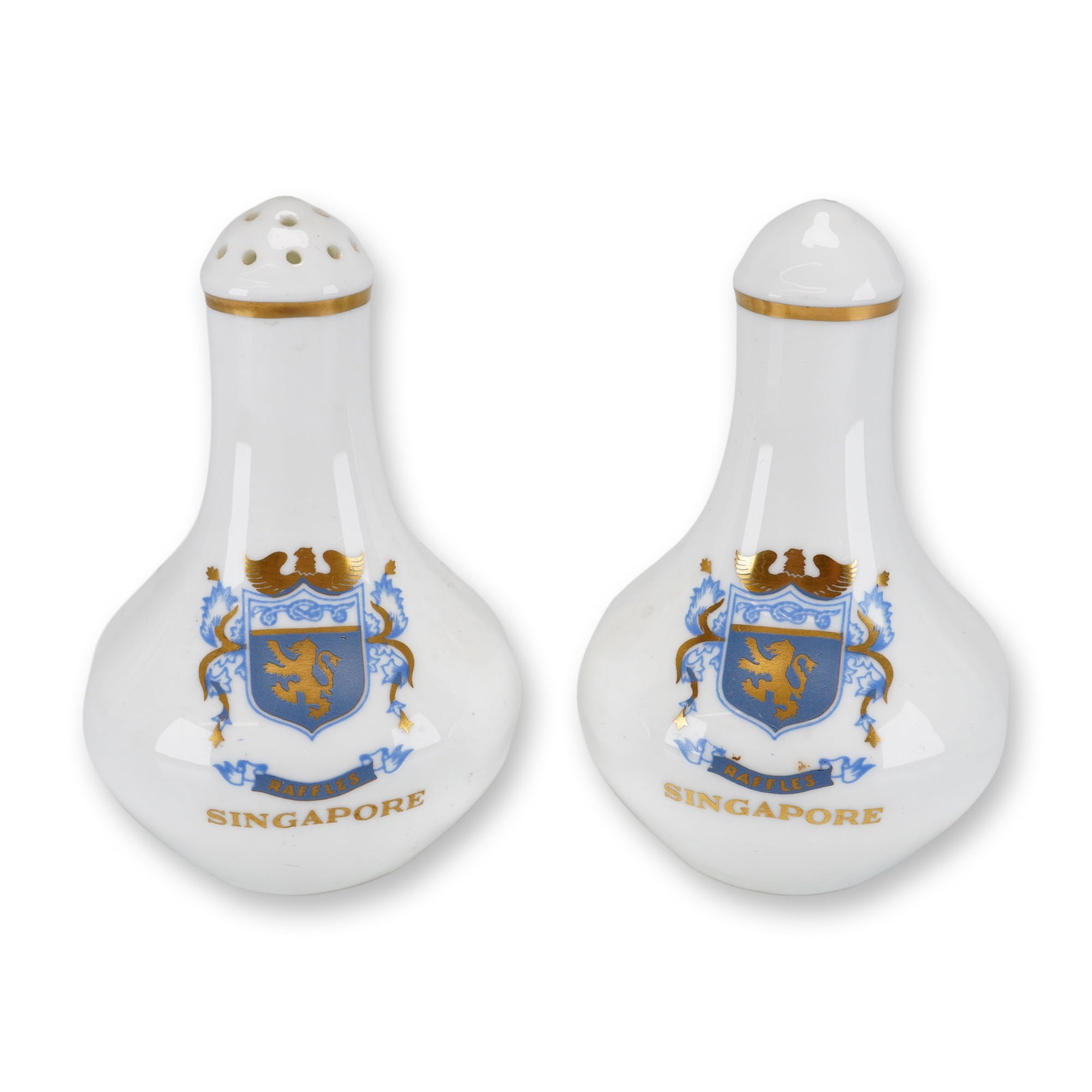 Pair of Wedgwood Hotelware Raffles Hotel Singapore Salt and Pepper Shakers: A pair of porcelain salt and pepper shakers manufactured by Wedgwood for the Raffles Hotel in Singapore. These items are crafted from commercial-grade hotelware porcelain and feature pear-shaped bulbo