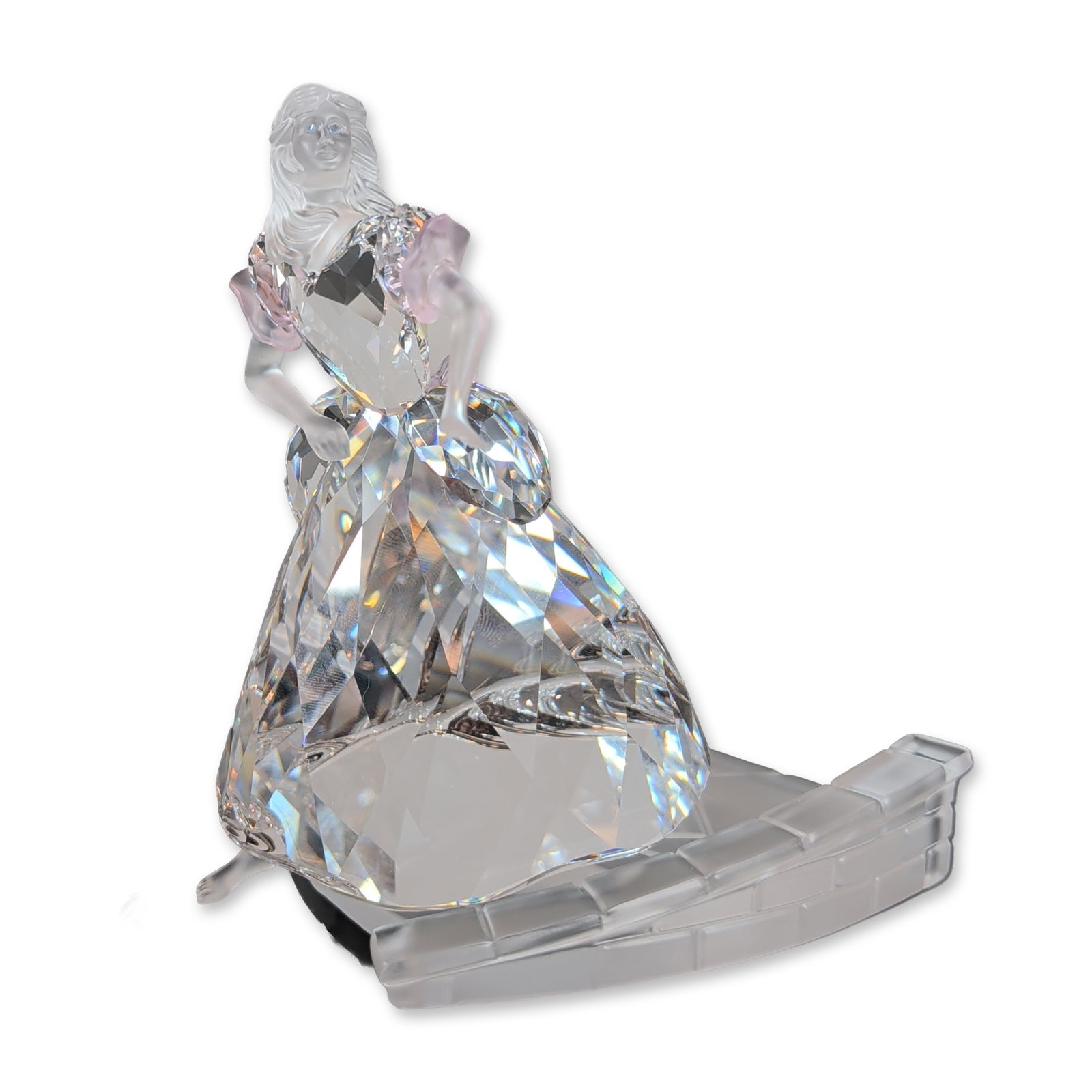 Swarovski Cinderella with Slipper Crystal Figurine: Swarovski crystal figurine from the Fables and Fairy Tales series, depicting Cinderella. The character is portrayed in a multi-faceted clear lead crystal ballgown accented with rose-colored trim. The 