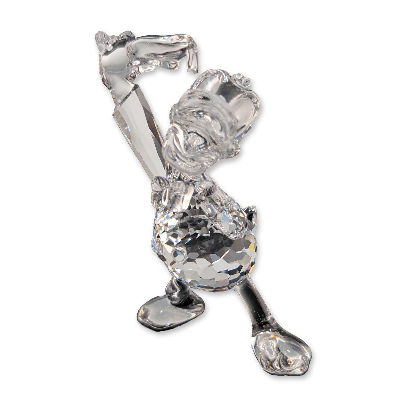 Swarovski Disney Crystal Donald Duck Figurine: Swarovski figurine in faceted clear lead crystal, depicting the Disney character Donald Duck in a standing pose. The piece features a multifaceted spherical body with smooth molded limbs, head, and fe