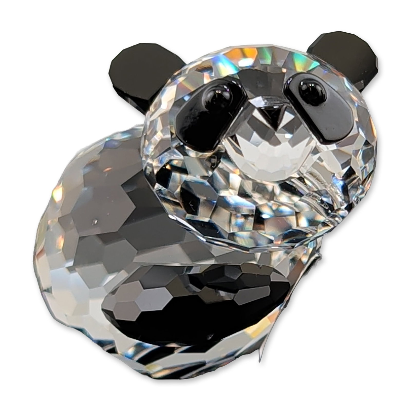 Swarovski Crystal Figurine, Panda Mother: Swarovski Silver Crystal. Panda figurine in faceted lead crystal, featuring a clear faceted body and head with jet black crystal accents for the ears, eyes, and limbs. Etched Swarovski swan logo is pr