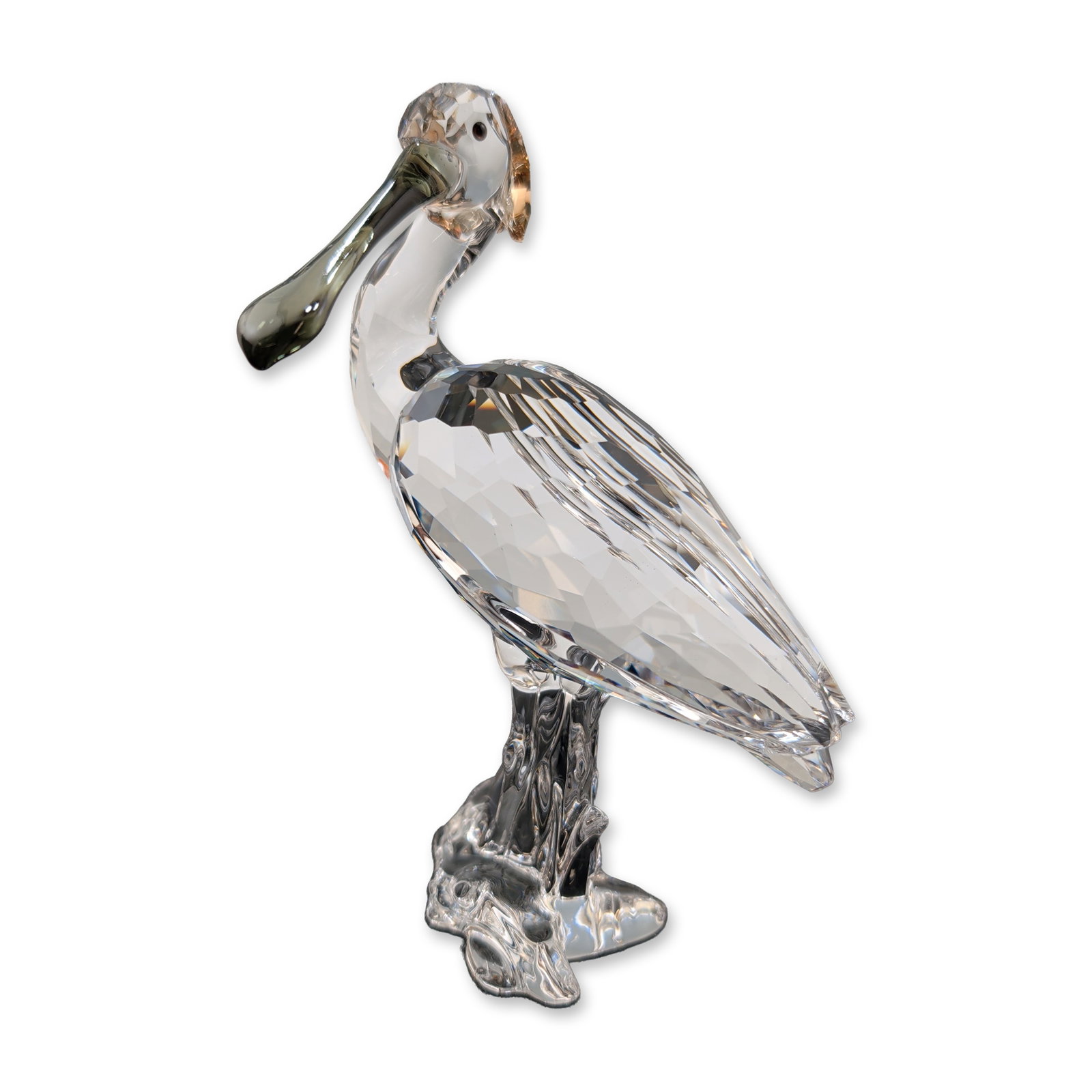 Swarovski Crystal Bird Figurine, Spoonbill: Swarovski Spoonbill bird figurine in faceted clear lead crystal, part of the Feathered Beauties collection. It features a multi-faceted body and head with a smooth curved neck and a dark tint bill. Th