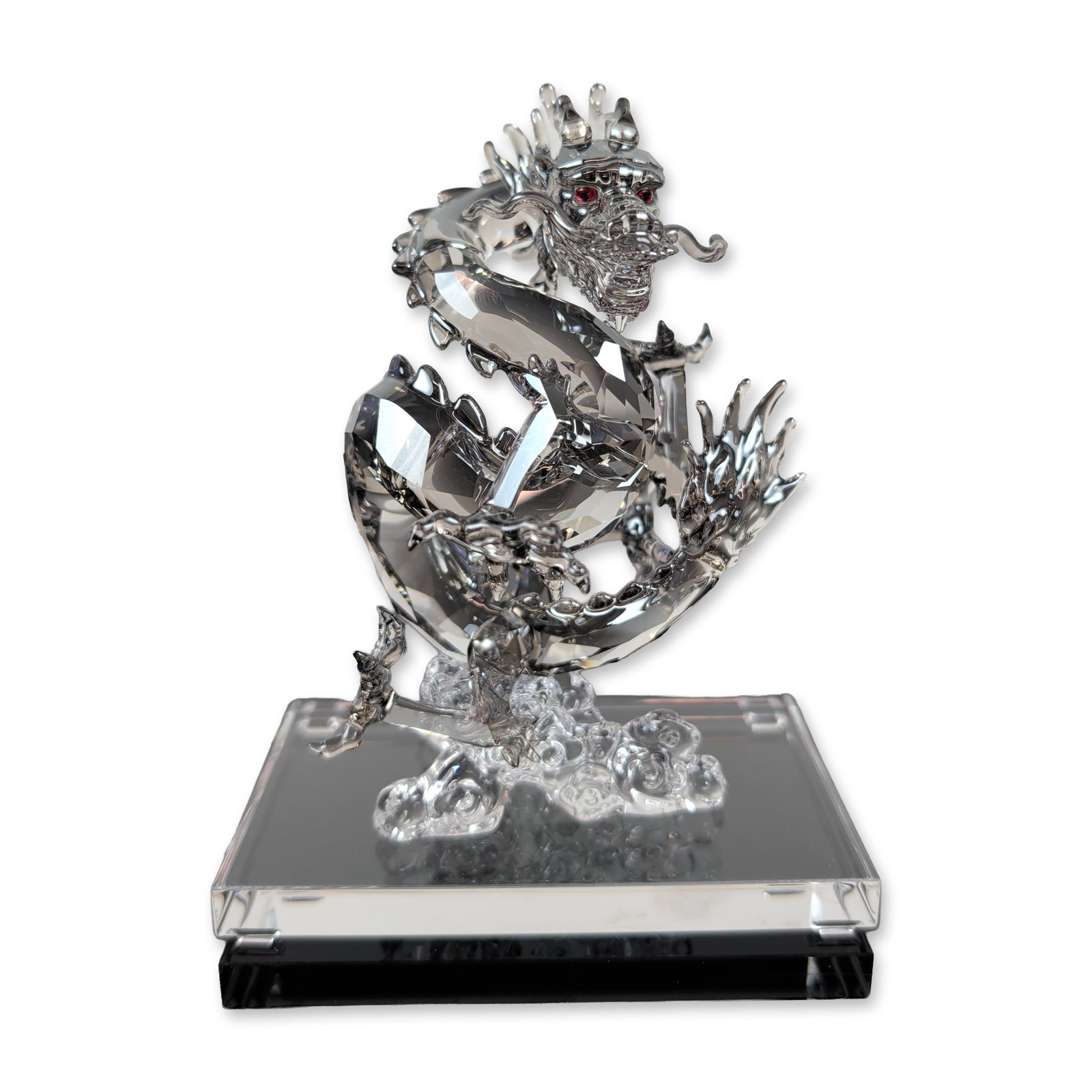 Swarovski Clear Crystal Dragon Signed SCS Figurine: Swarovski Dragon figurine in faceted Satin crystal with vibrant Light Siam crystal eyes and a traditional oriental serpentine form. The piece is presented with a clear display base. Included are the o