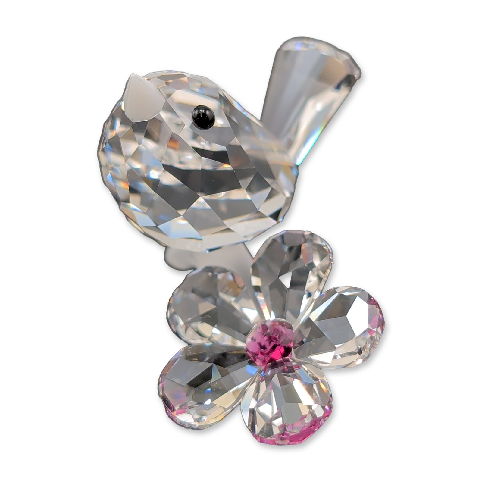 Swarovski Crystal Baby Bird and Flower Figurine: Swarovski figurine in faceted lead crystal, depicting a baby bird perched beside a flower. The bird features a clear faceted body with a black inset crystal eye and a frosted white beak. The flower is
