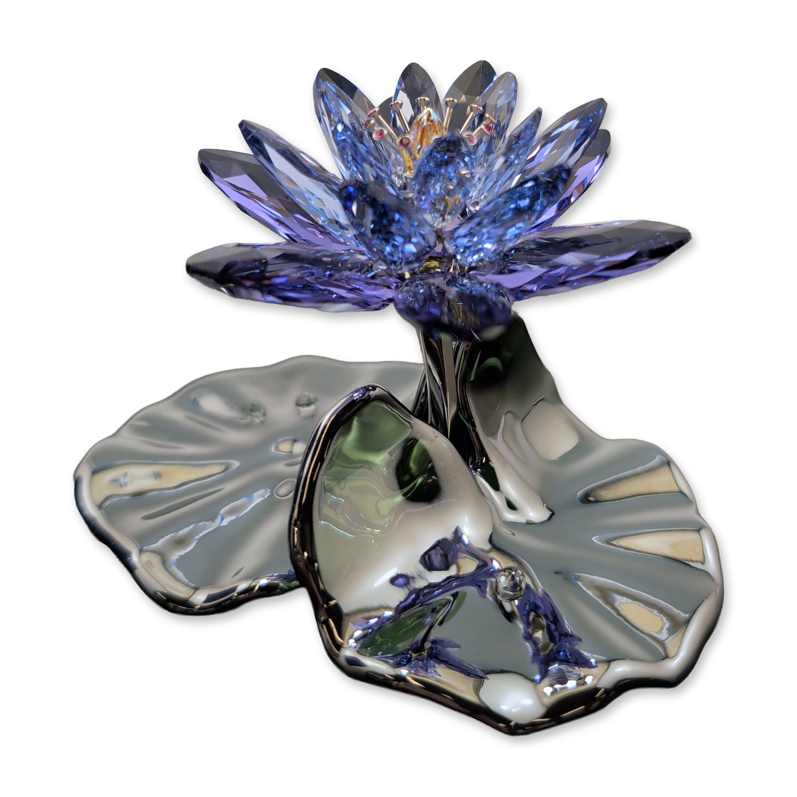 Swarovski Crystal Paradise Flowers Figurine, Blue Violet Waterlily Signed A. Hirzinger: Swarovski crystal and metal figurine from the Paradise Flower collection, titled Blue Violet Waterlily. The piece features a central lotus bloom composed of multi-faceted blue and violet crystal petal