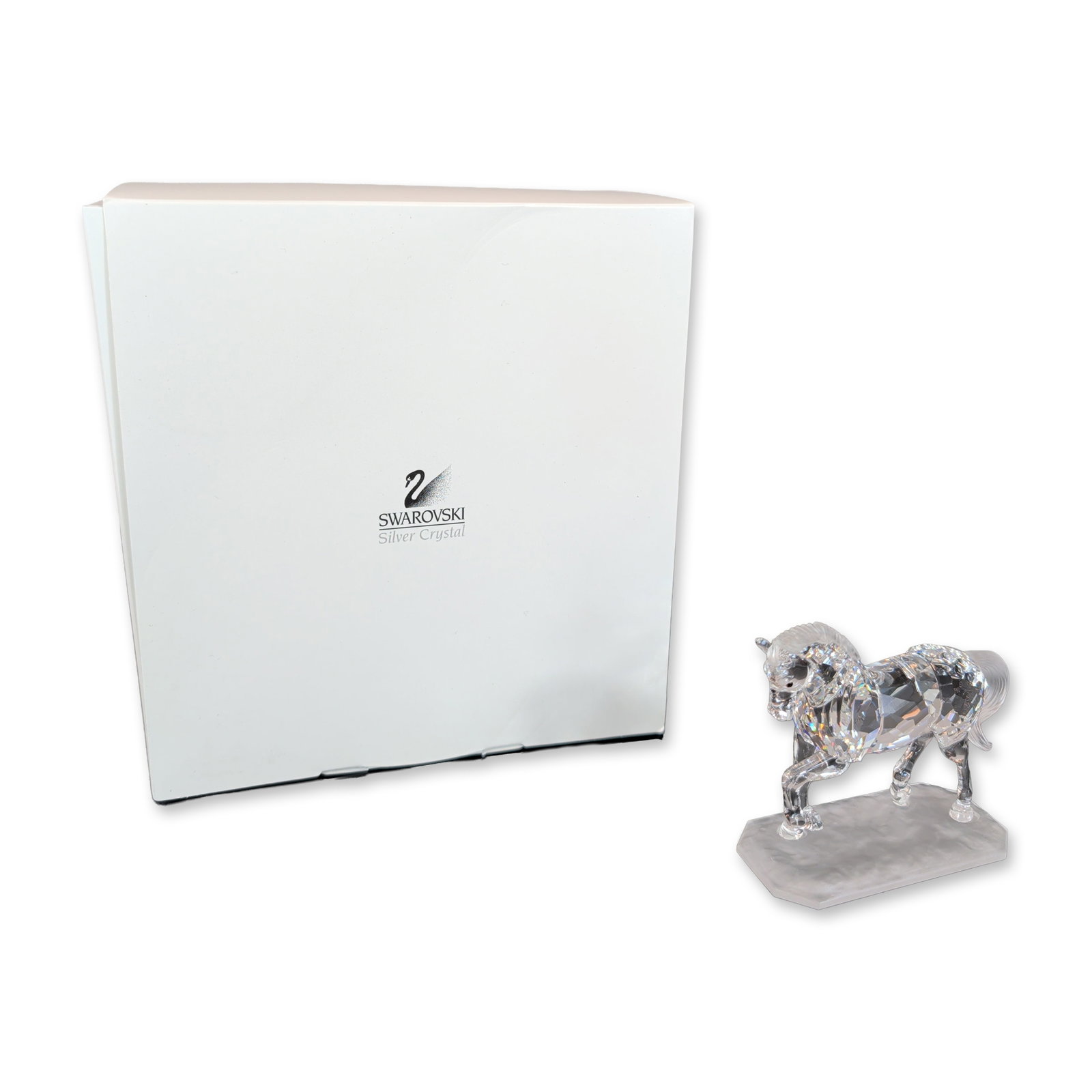 Swarovski Silver Crystal Arabian Stallion Figurine: Swarovski Silver Crystal Stallion figurine. The piece is constructed of faceted clear lead crystal with a frosted crystal mane and tail, mounted on an integral frosted rectangular base with beveled co