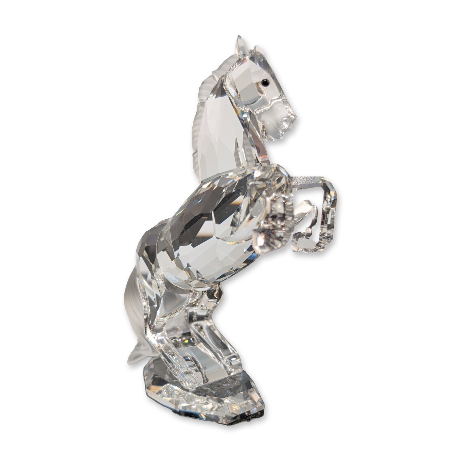 Swarovski Silver Crystal Figurine, White Stallion: Swarovski Horse figurine from the Silver Crystal collection in faceted lead crystal, depicting the horse in a rearing pose. The piece features a faceted clear crystal body and limbs with a frosted, te
