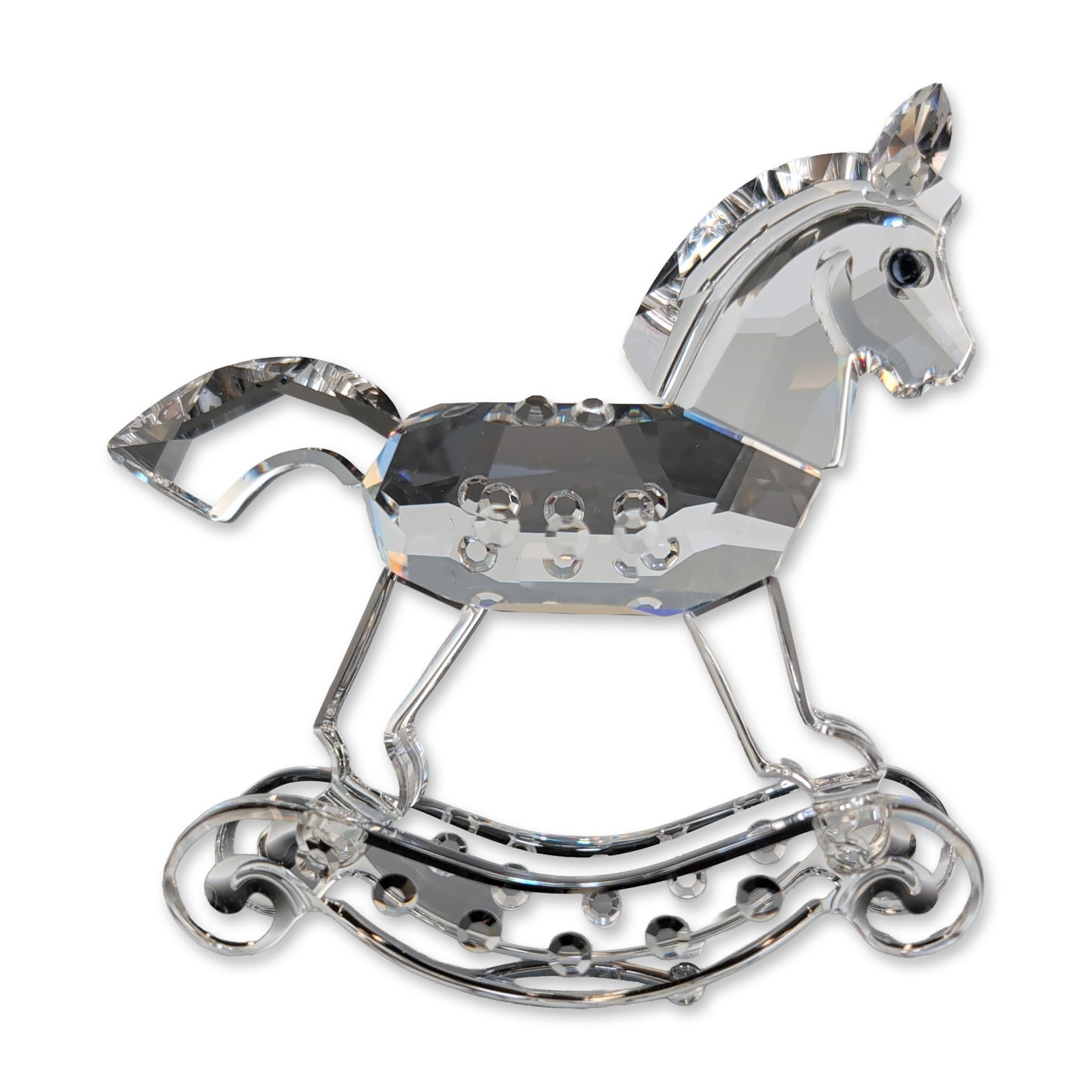Swarovski Silver Crystal Rocking Horse Figurine: Swarovski Silver Crystal collection rocking horse figurine. The figurine is composed of faceted clear crystal components forming the body, head, and tail, accented by crystal eyes. The horse is mounte