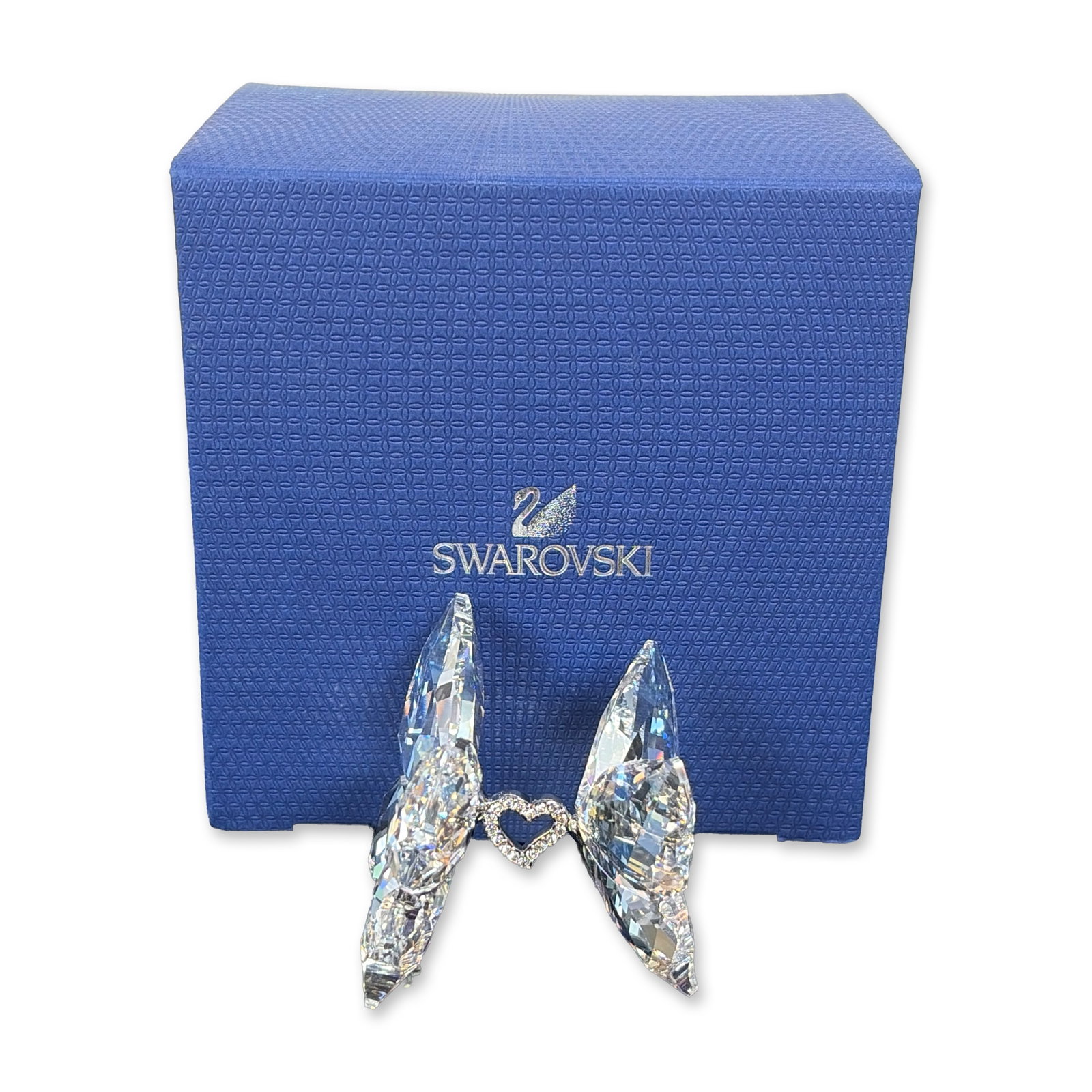 Swarovski Crystal Signed Love Butterflies Figurine: Swarovski lead crystal figurine from the With Love collection. It showcases two clear crystal butterflies with multifaceted wings, joined at the center by a heart-shaped rhodium-plated metal piece ado