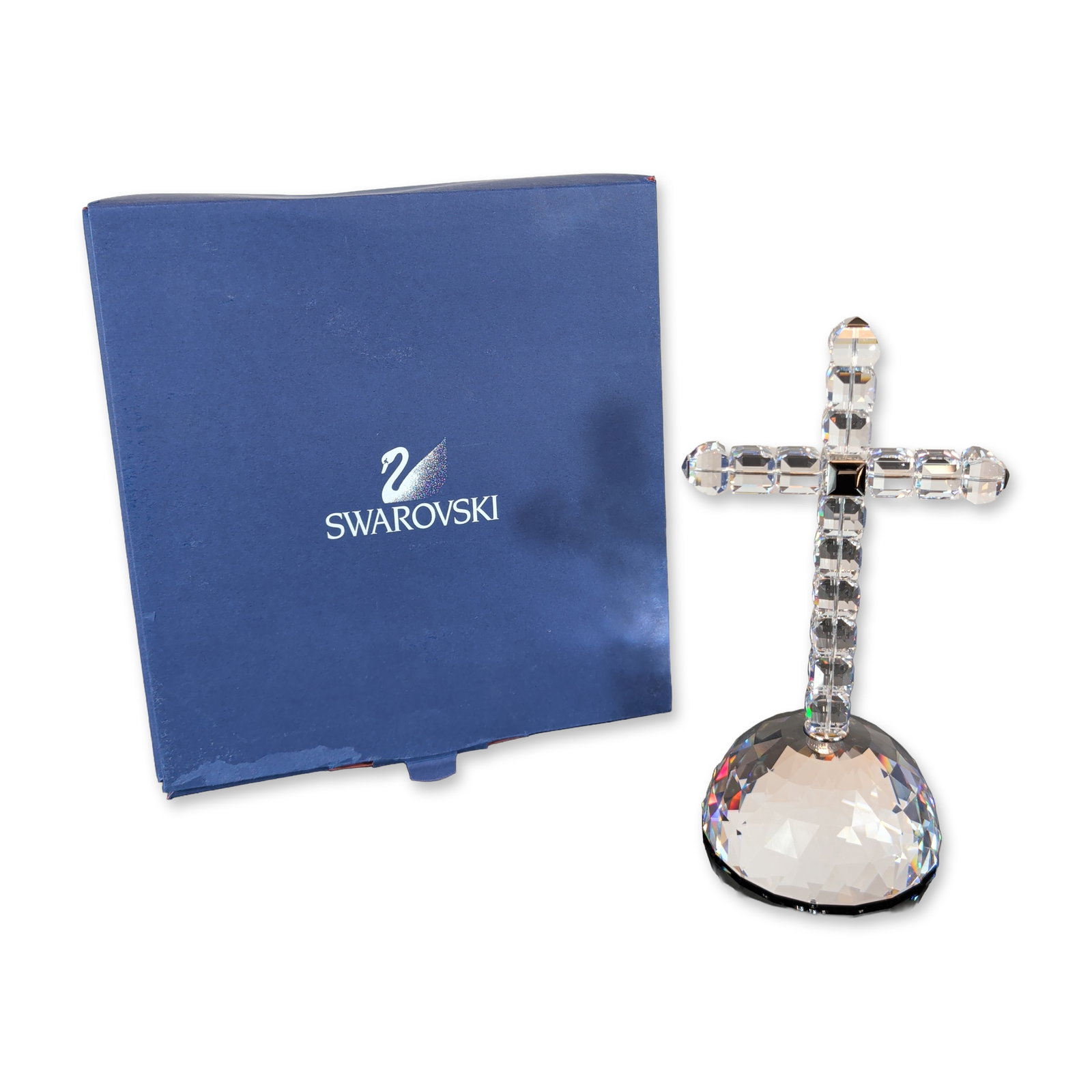 Swarovski Crystal Cross of Light Figurine: Swarovski. Cross of Light decorative figurine in faceted lead crystal, featuring a cross constructed from sixteen faceted rectangular beads joined by a central square element and mounted upon a multi-