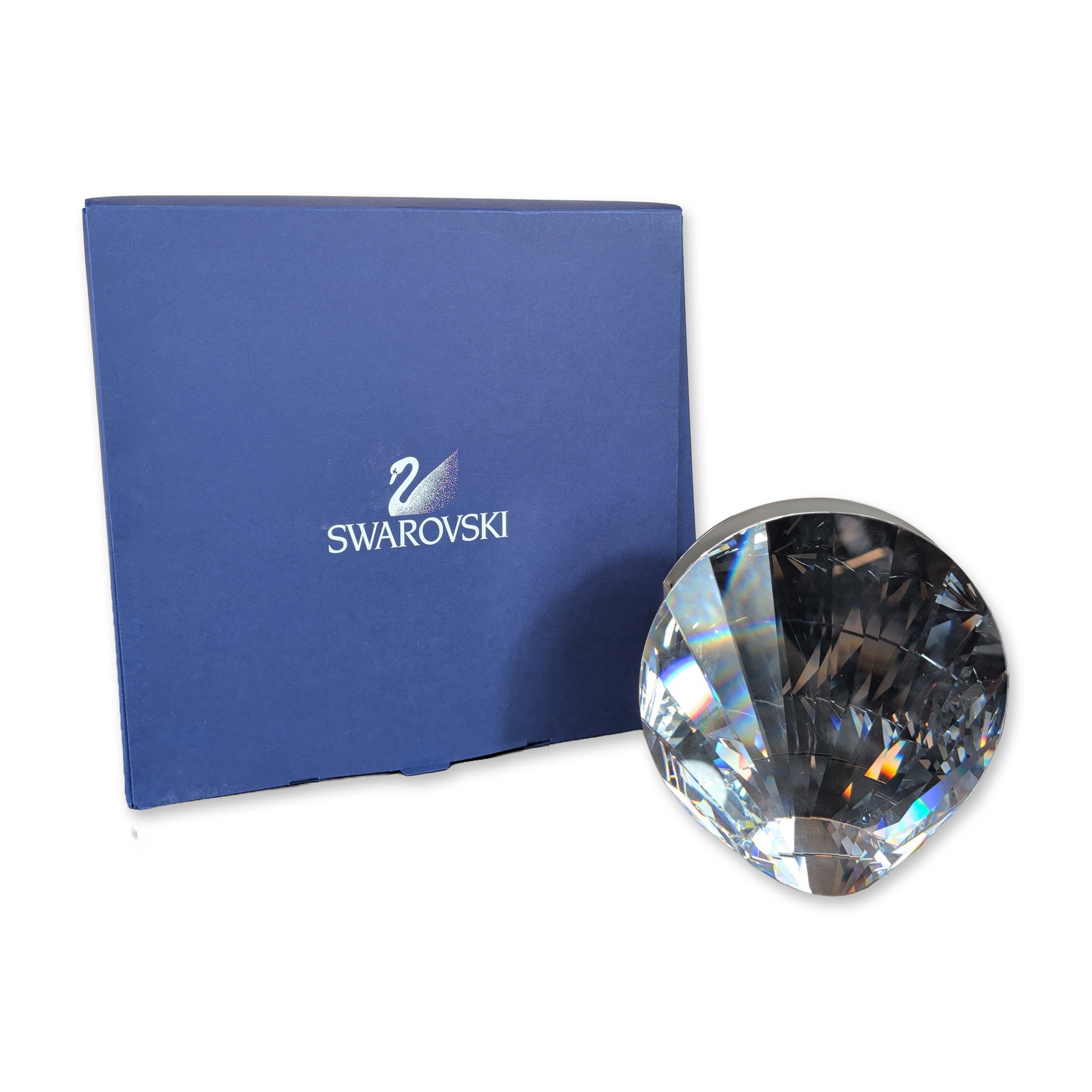 Swarovski Faceted Crystal Shell Vase: Swarovski faceted lead crystal large shell vase. Part of the Crystal Classics collection, it features a grand, fan-shaped faceted design paired with a subtle rhodium-plated metal support base. Swarovs