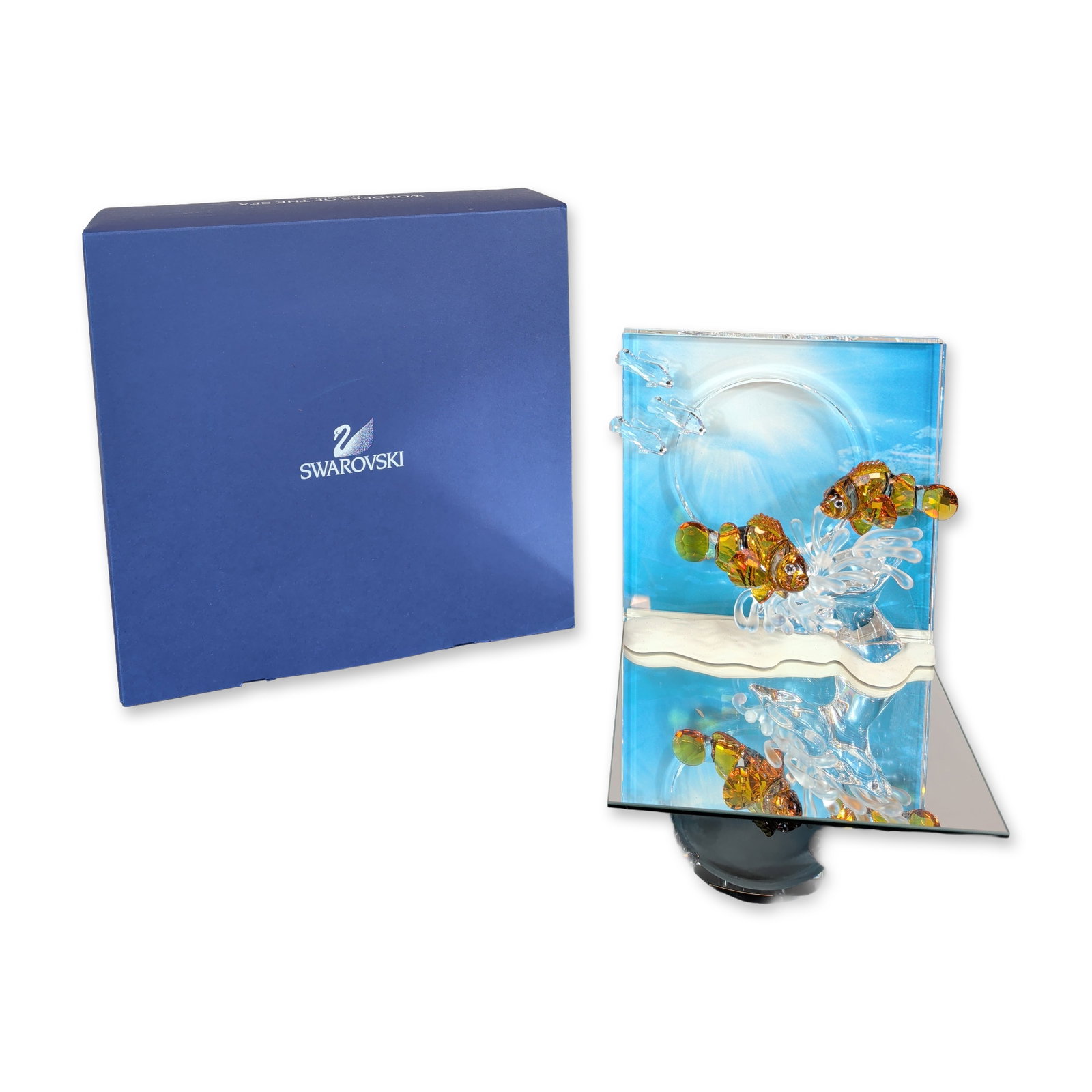 Swarovski Harmony Wonders of the Sea Crystal Figurine: Swarovski Wonders of the Sea collection crystal figurine titled Harmony, released in 2005 as the first edition in the series. The scene depicts two faceted orange and clear crystal clownfish swimming 