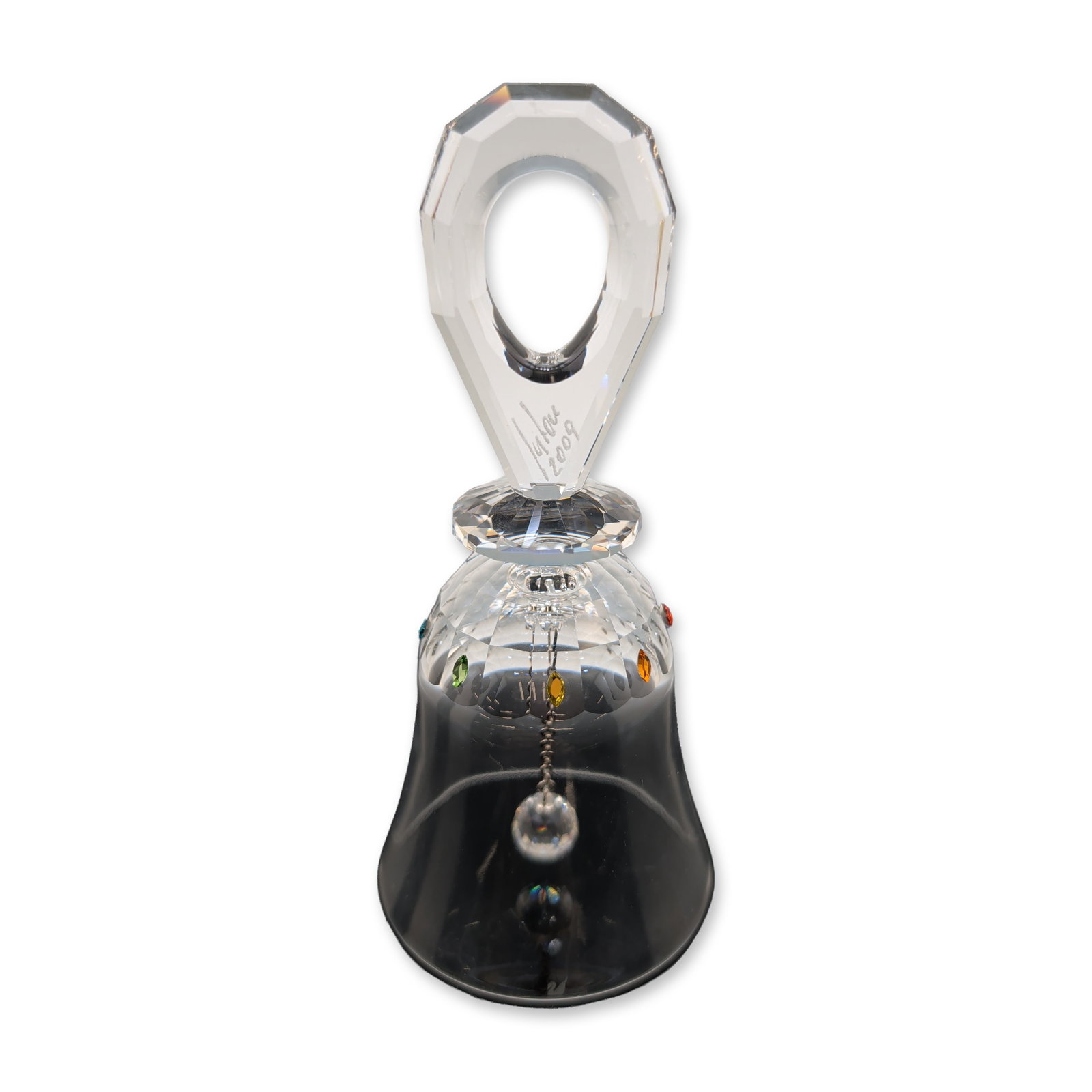 Swarovski Multi-Color Crystal Table Bell, Solaris: Swarovski Silver Crystal collection Solaris table bell. Lead crystal construction featuring a bell-shaped body with a precision-cut diamond facet pattern on the upper portion, accented by inset multic