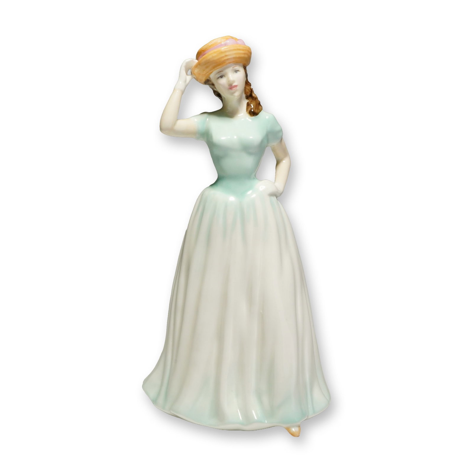 Royal Doulton Classics Happy Birthday 2001 Figurine HN4308: This Royal Doulton bone china figurine from the Happy Birthday collection, 2001 HN4308, was modeled by designer Nada M. Pedley. The hand-made and hand-decorated piece depicts a young woman in a floor-