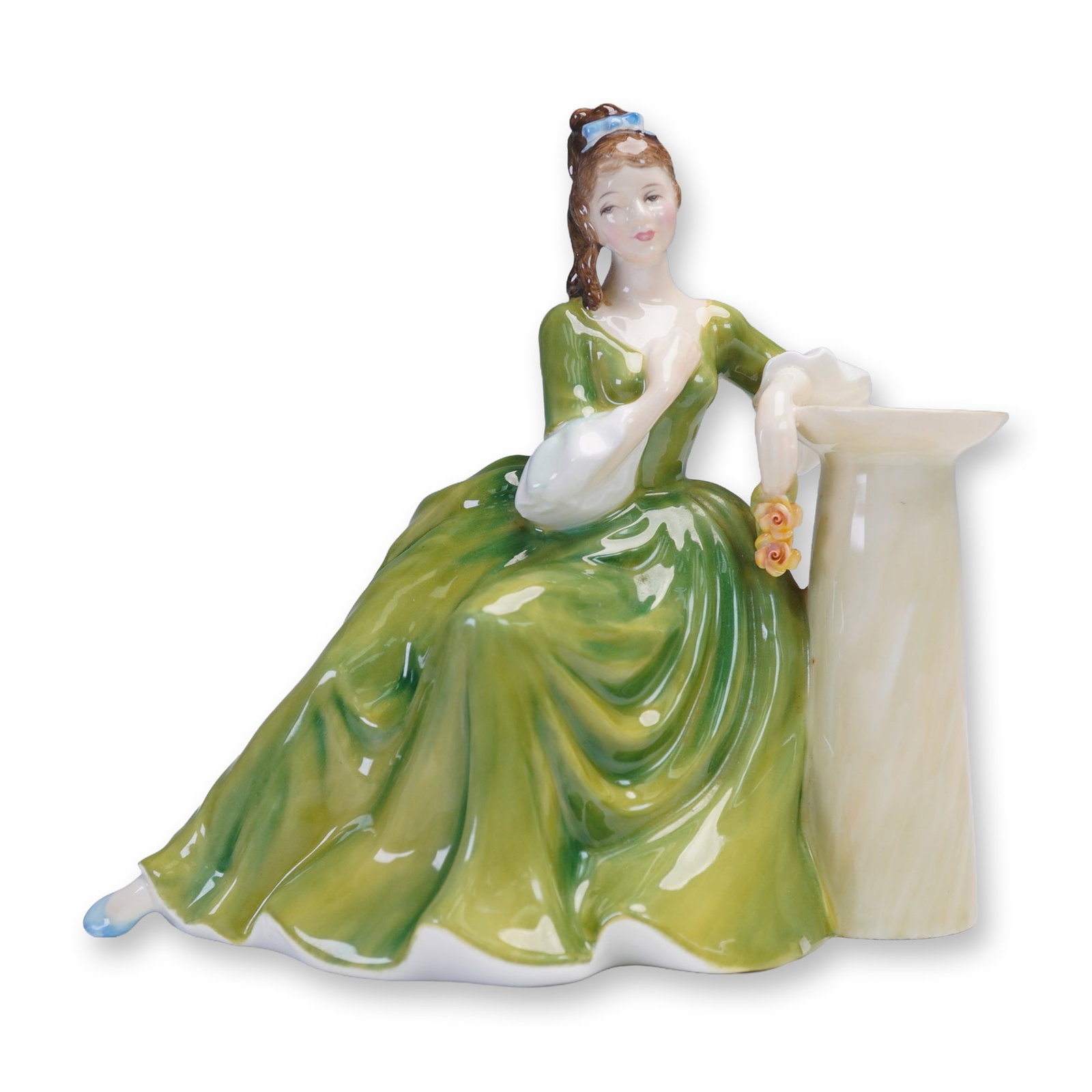Royal Doulton Figurine Secret Thoughts HN2382 by Peggy Davies: A charming Royal Doulton figurine titled Secret Thoughts (HN 2382), featuring a young lady elegantly posed in a vivid green gown with white cuffs, seated beside a column while holding a delicate spray