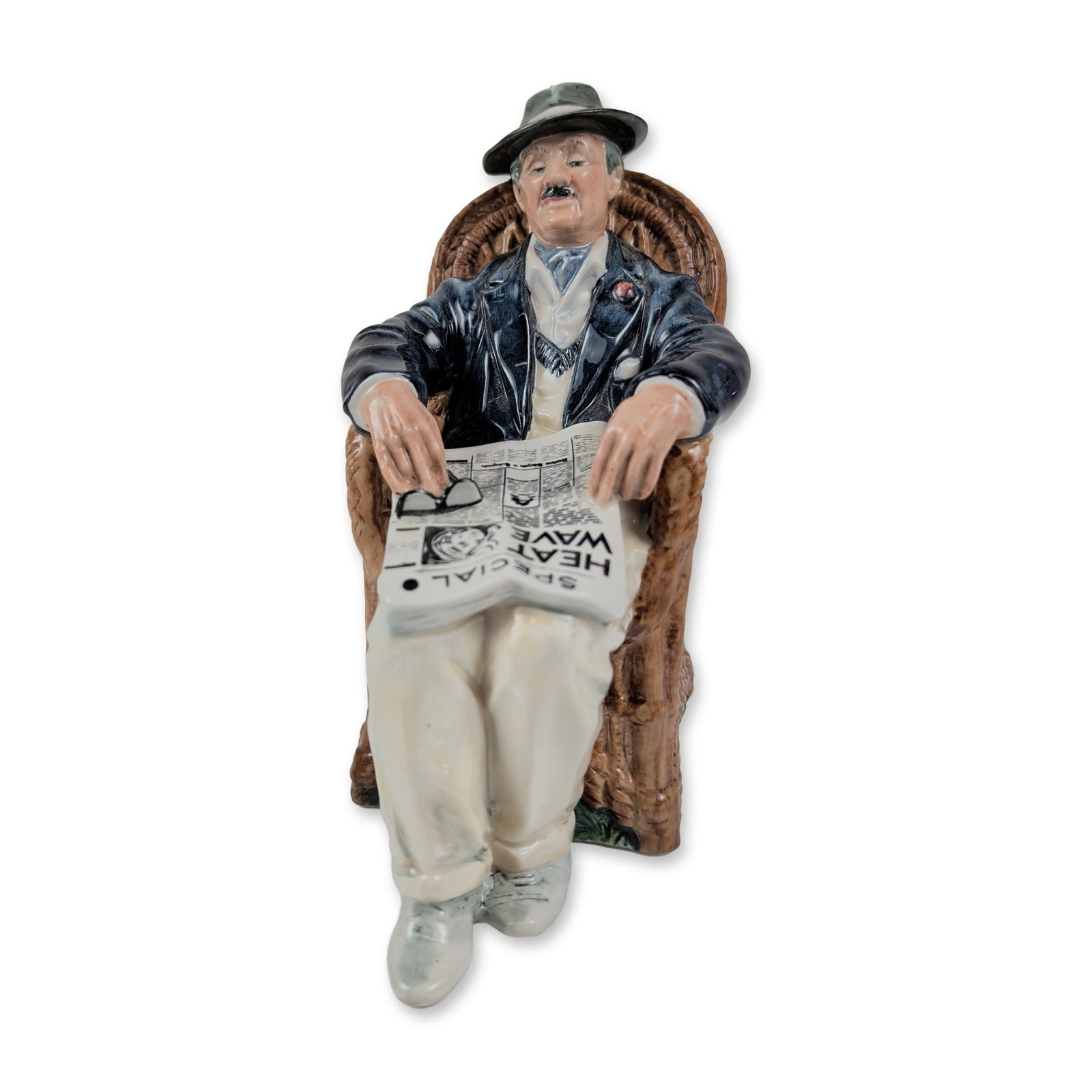 Royal Doulton Taking Things Easy Porcelain Figurine HN2677: Royal Doulton (English, 20th century). Porcelain figurine titled Taking Things Easy, model HN 2677. The figure depicts a gentleman in a dark blue jacket and beige trousers reclining in a brown wicker 